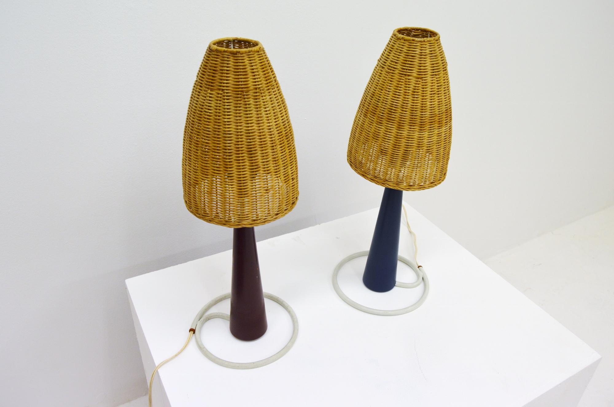 Rare pair of table lamps manufactured by Bergboms marked Bergbom B-08.
One red and one blue.
White lacquered metal and lacqered wood. Lamp shades of wooden rattan/ cane.
Both have their original European electricity left, which works. We can