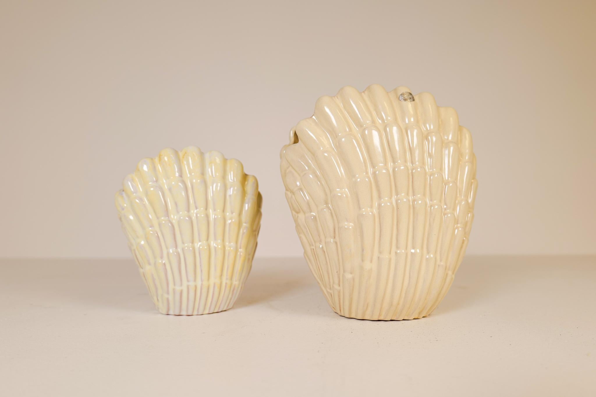 Seashell vases Designed by Vicke Lindstrand for Upsala Ekeby in Sweden during the 1940s. This pair gives a good impression and are a good example of the great craftmanship in Sweden during this time. One large and one little, smaller version of