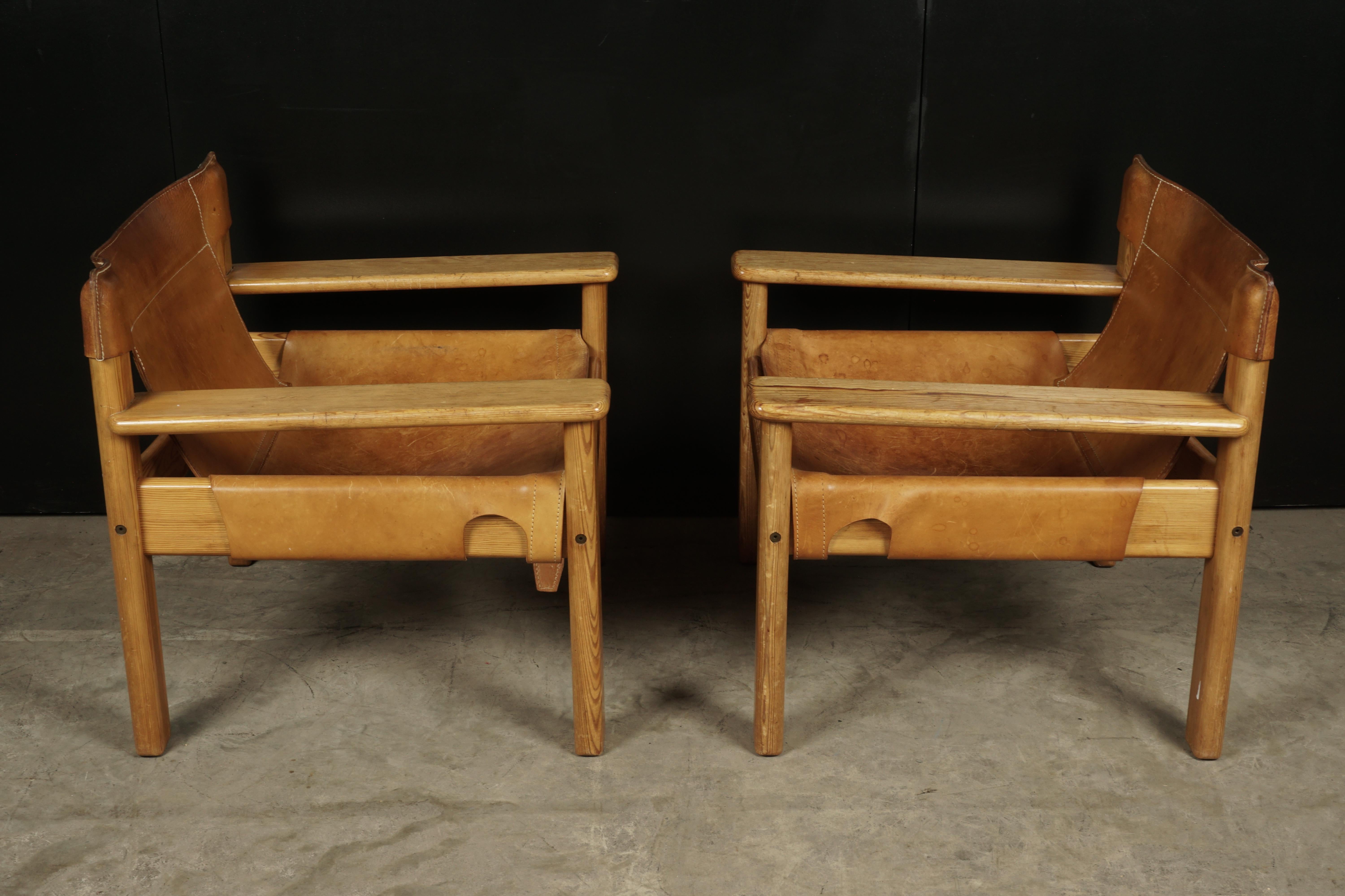Midcentury pair of Spanish style chairs from Sweden, circa 1970. Original thick cognac leather on a solid pine frame. Leather with fantastic color and patina.
