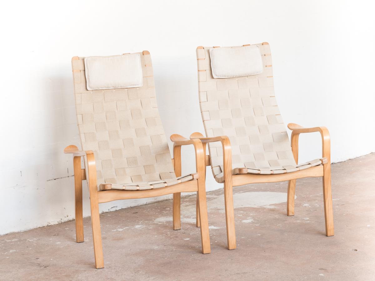 Midcentury pair of easy chairs designed by Yngve Ekström and manufactured by Swedese in Sweden in 1976. The name of this model is Primo. It is the high back version. A true Swedish classic! The easy chairs are in beech and natural webbing. They have