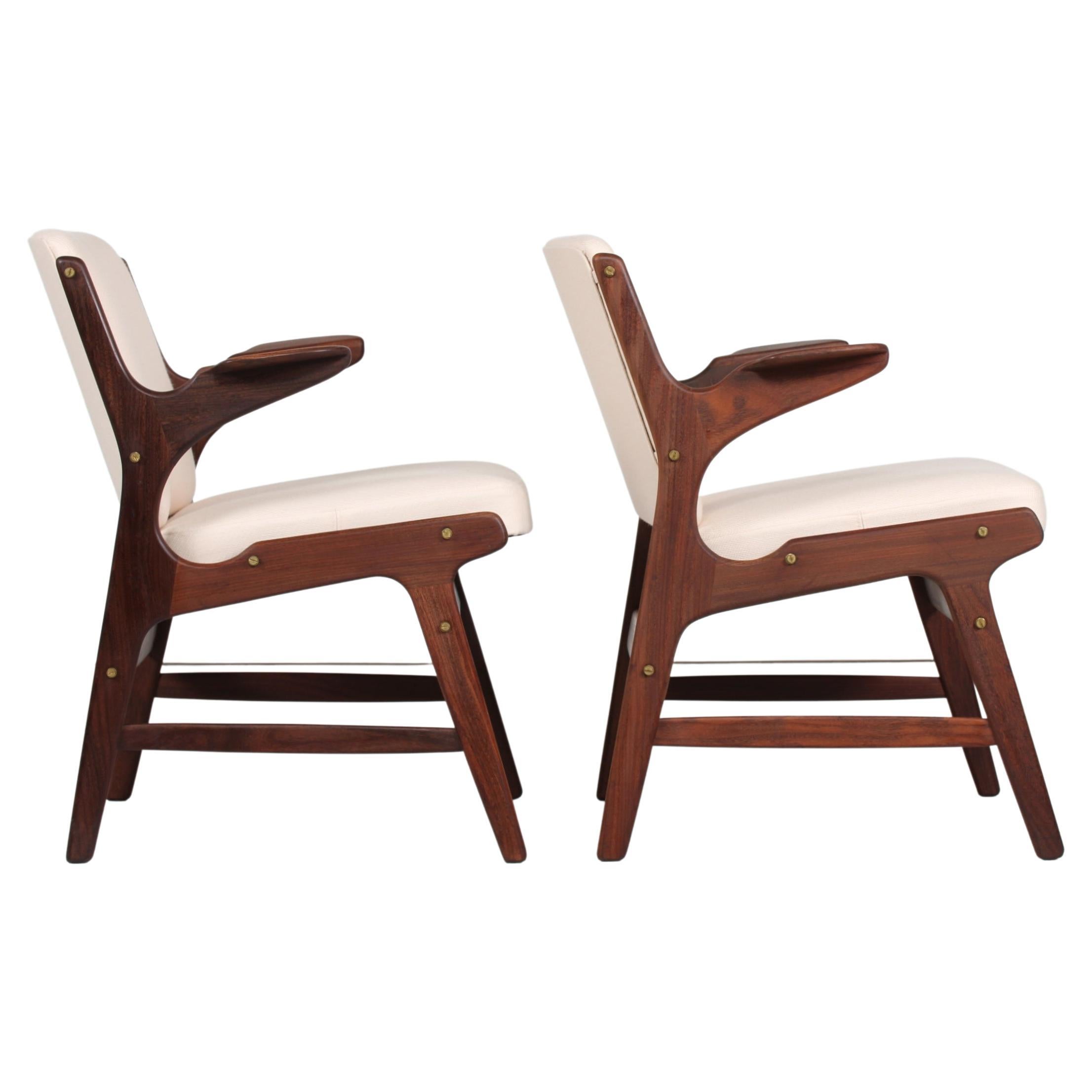 Pair of mid century easy armchairs model 310 by Arne Hovmand-Olsen
They are made in Denmark in the 1960s by A. R. Klingenberg & Søn

The frames are made of solid teak with brass screws and have upholstery with light fabric.


