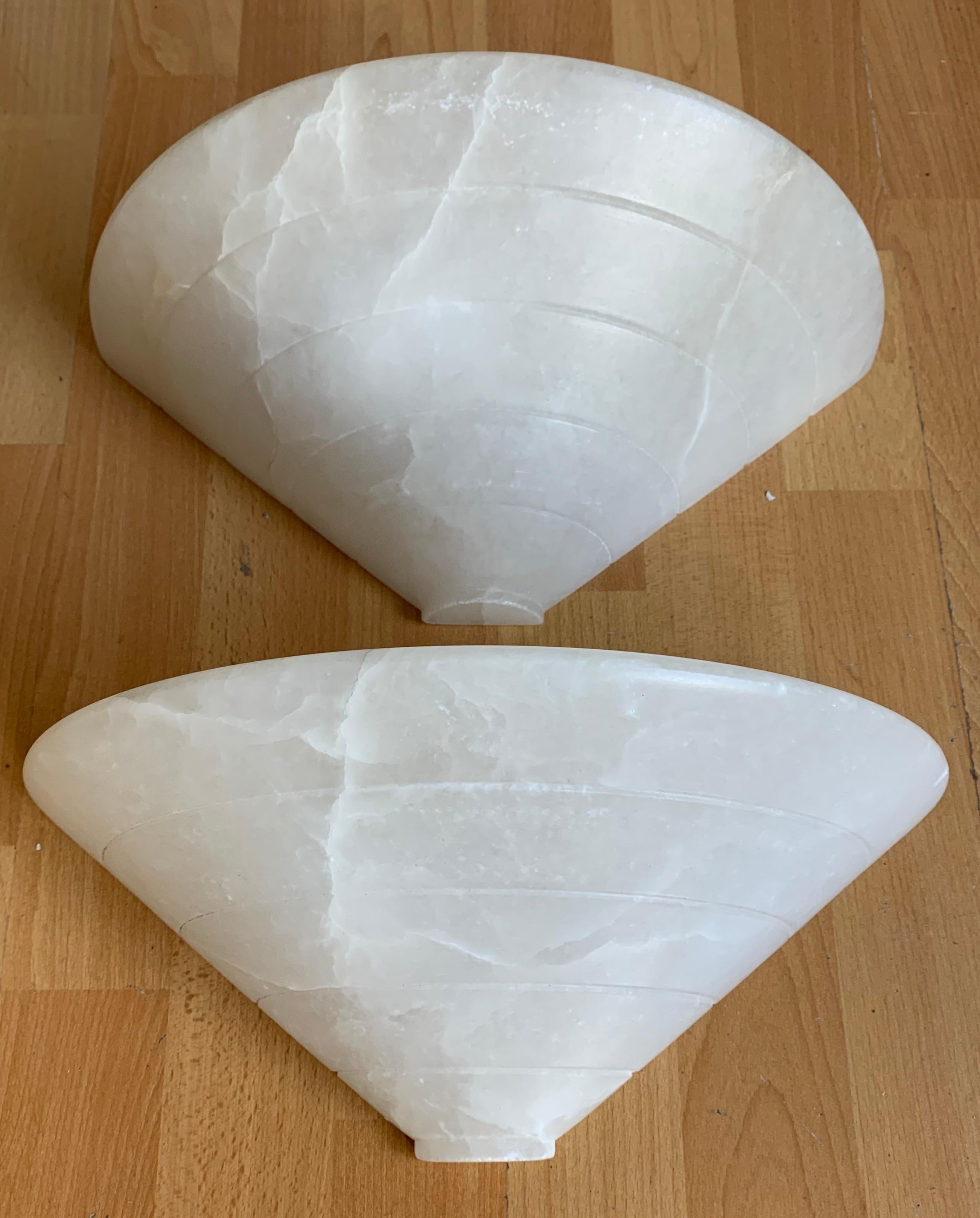 Wonderful shape, perfect size and excellent condition alabaster sconces.

This excellent condition pair of alabaster light fixtures for wall mounting will look great no matter where you decide to use them. They could grace the wall in your entryway,