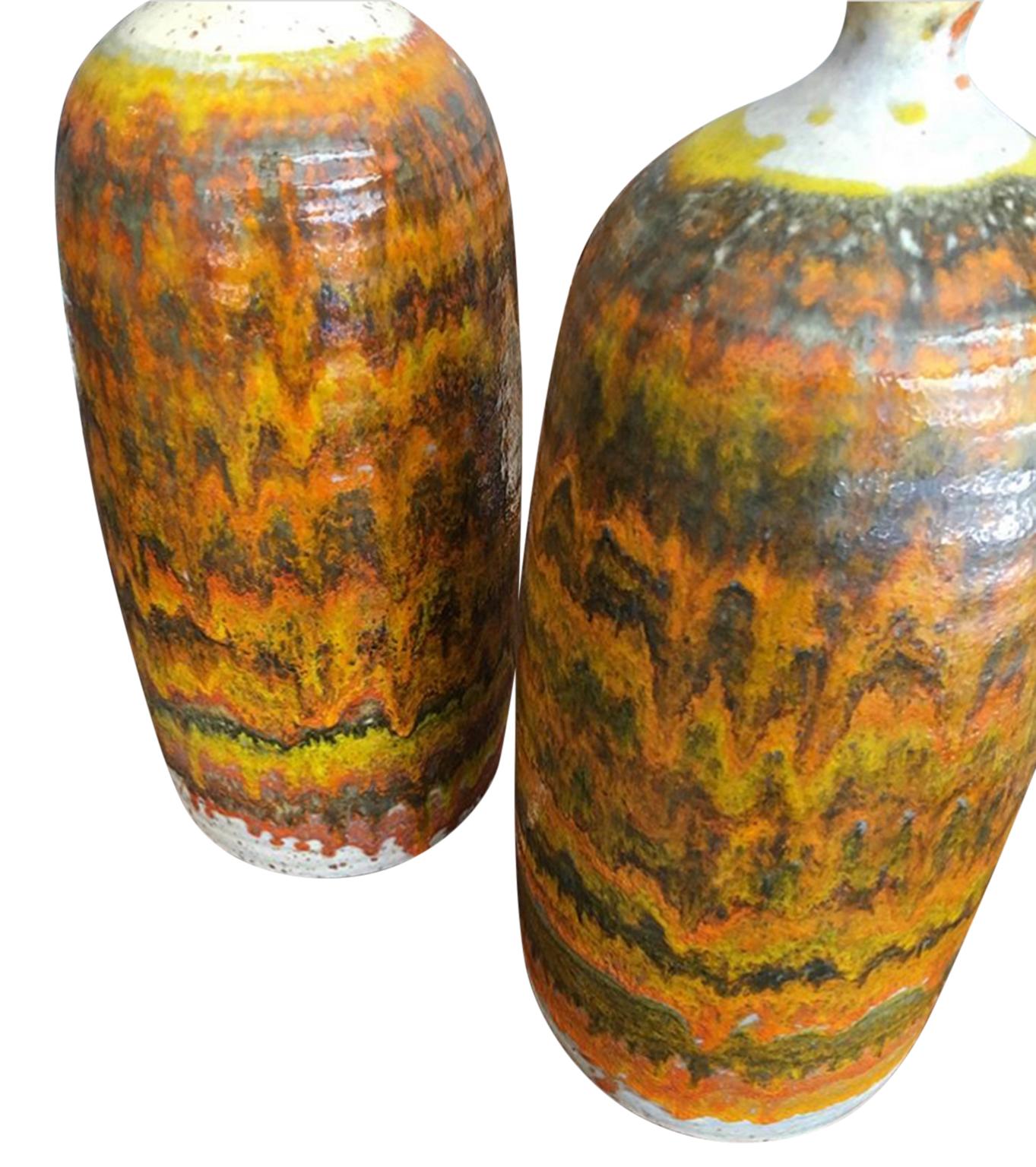 Amazing midcentury pair of unique lava glaze ceramic table lamps circa 1960- designer unknown. Made in Italy - see images. Beautiful unique pair of matching lamps. Comes with original shades. Lamps work 100%.