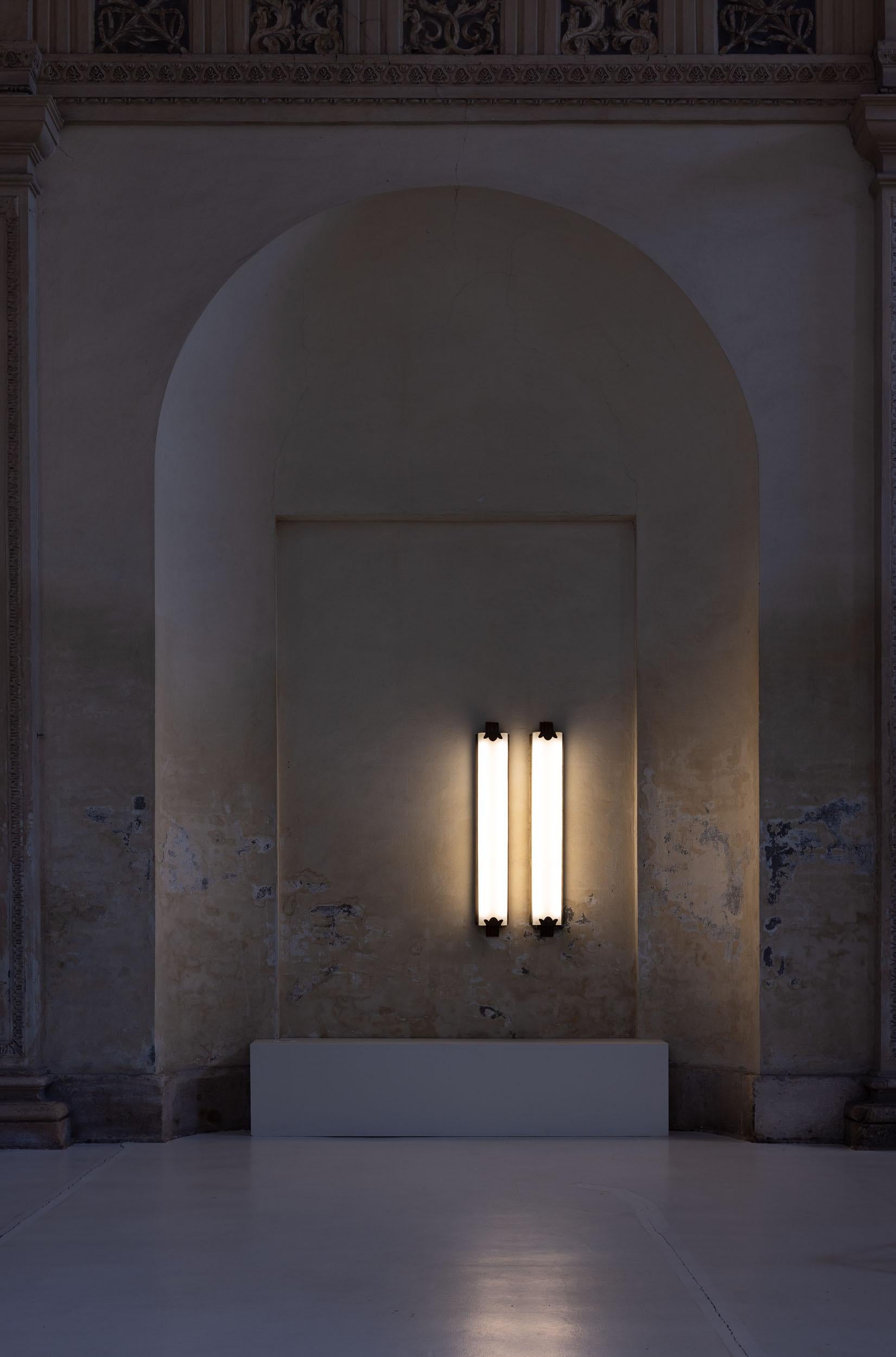 Elegant pair of midcentury wall lamps, featuring opaline white glass and a brass structure with intricate decorative details, adding a touch of timeless elegance to any space. 
These impressive lamps, embody the sophistication and craftsmanship of