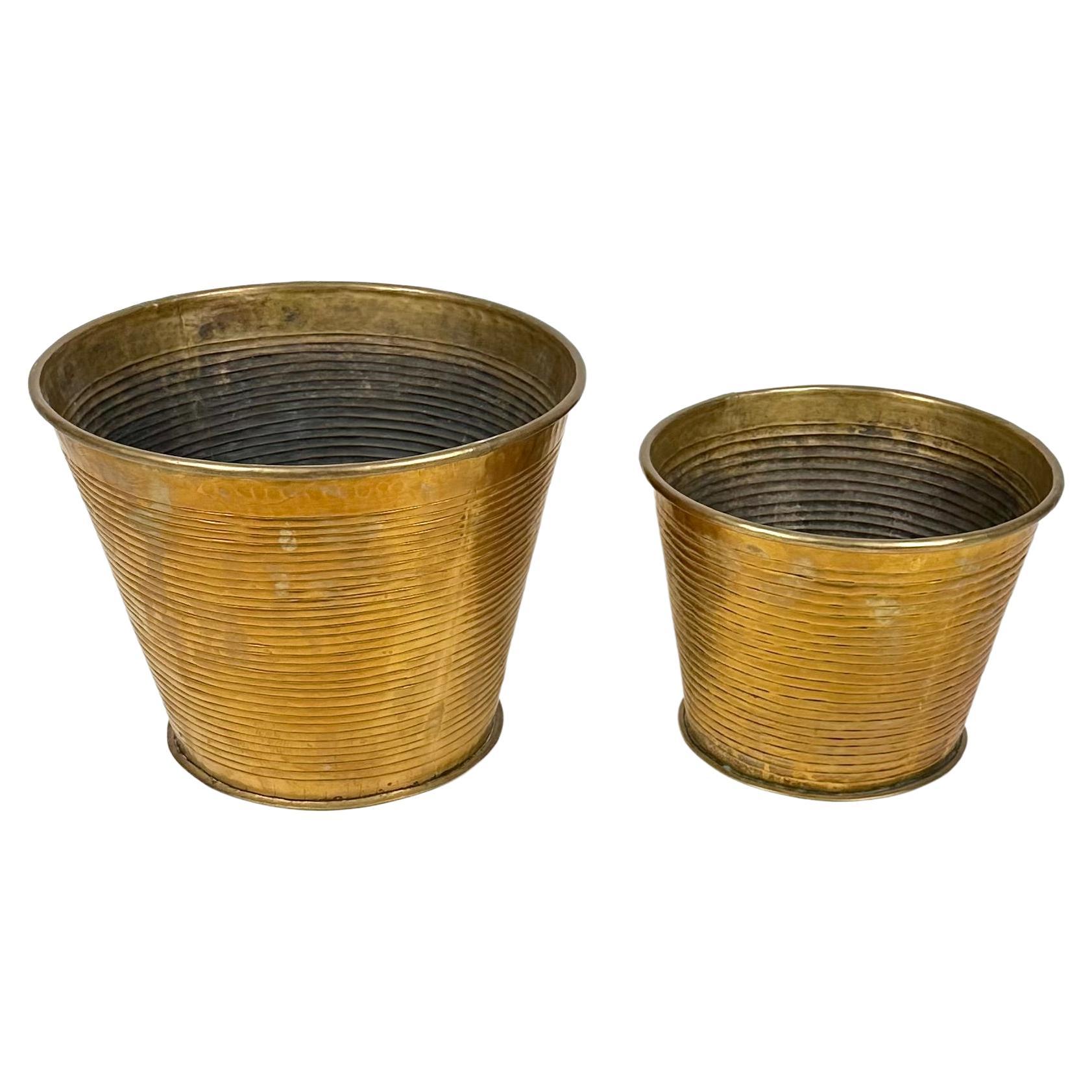 Midcentury pair of waste paper basket in brass.

Made in Italy in the 1960s.