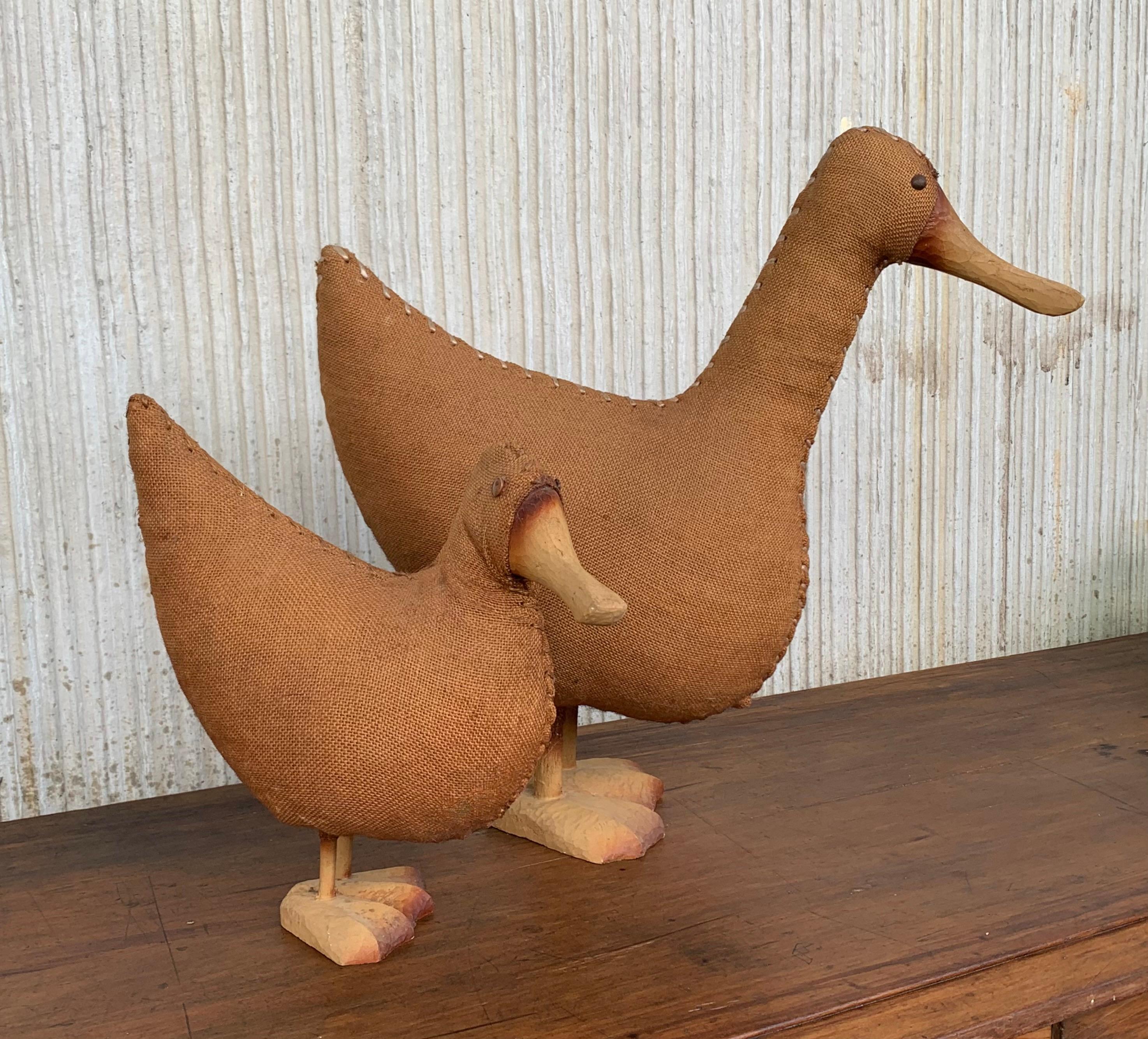 Wicker duck from with an intricate woven wicker structure and highlighted with wood wings and a sculpted bill and feet.