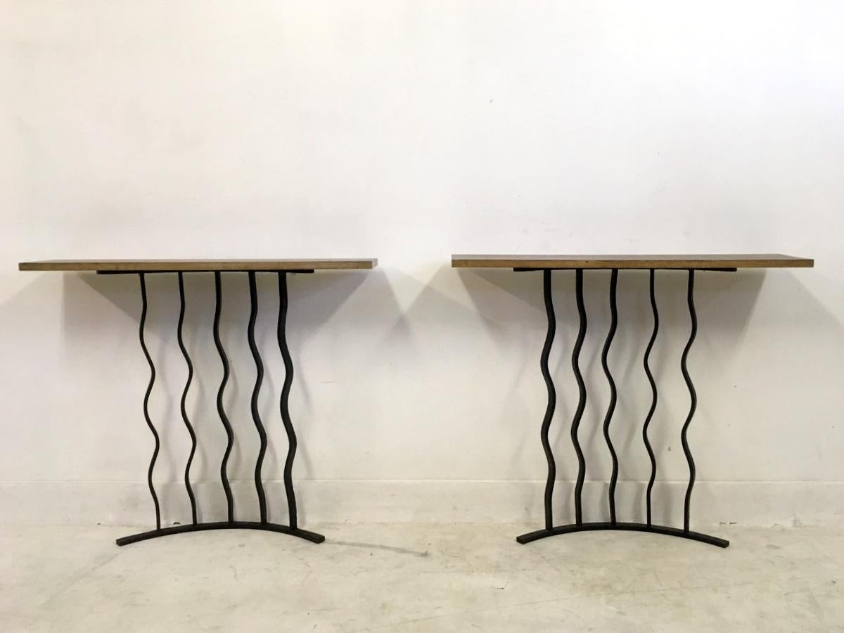 A pair of console tables

Wavy wrought iron bases

Limed oak tops

French, 1940s.