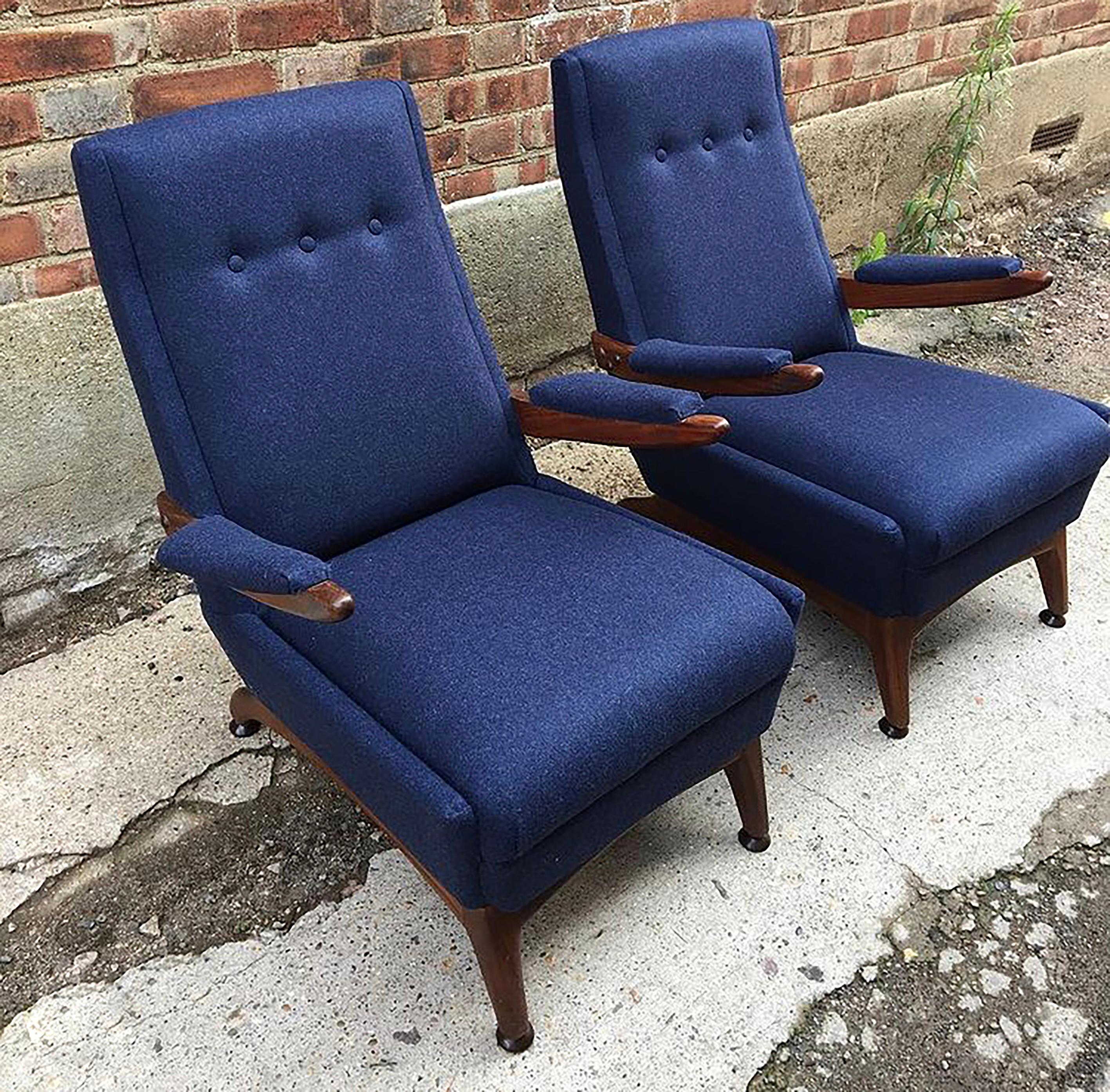 Pair of lovely wooden armchairs manufactured in the 1960s. The teak frame, polished in Danish oil, is beautifully hand carved with wonderful elegant curves. Incredibly comfortable, the low seat height makes these chairs ideal for lounging. 

Please