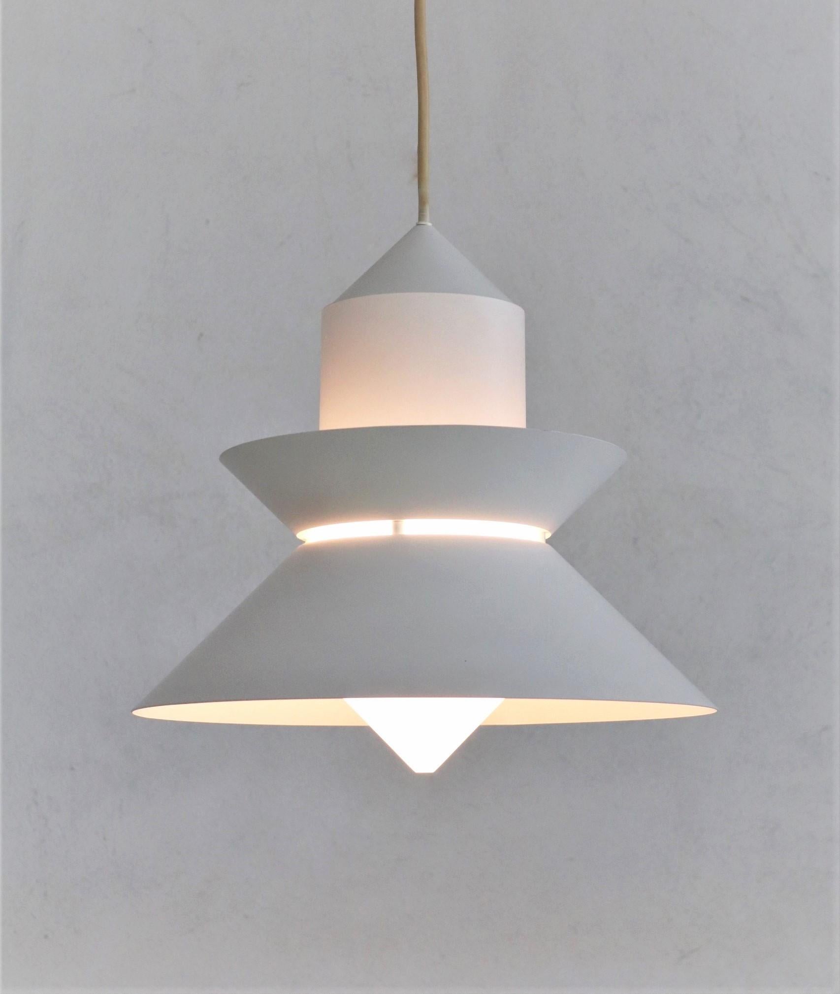 Gorgeous pendant lamp made of strong metal varnished in off-white color, and white glass, produced in the 1980s from best German production of that time. 
We have more items from the same production lot in three different sizes available.
This