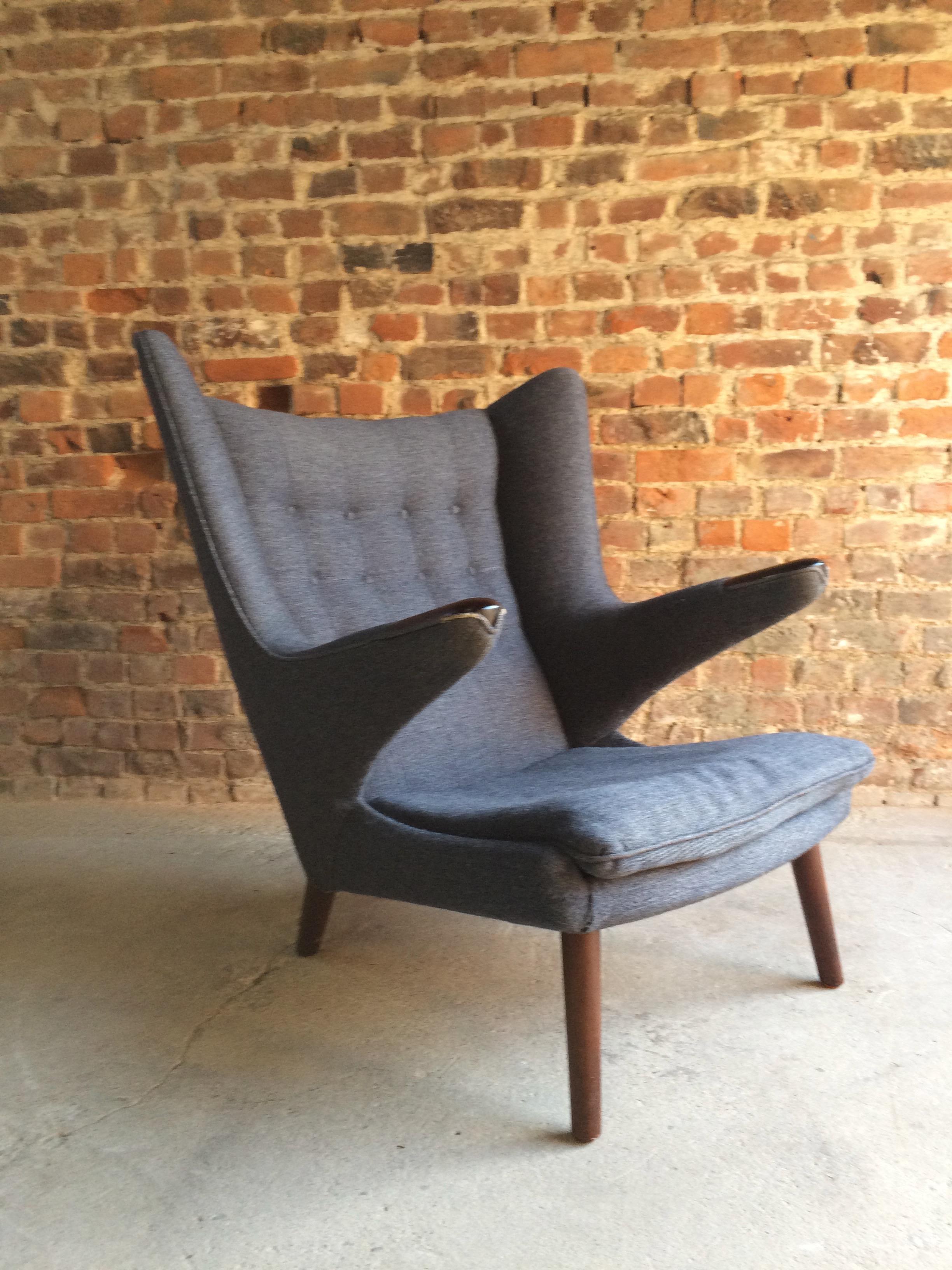 Magnificent Hans J Wegner (1940-2007) - An AP19 'Papa Bear' chair, otherwise known as a 'Bamsestol', designed 1951, this example dates to early 1960s, rosewood framed, blue wool fabric button back upholstered, and raised on turned supports, this