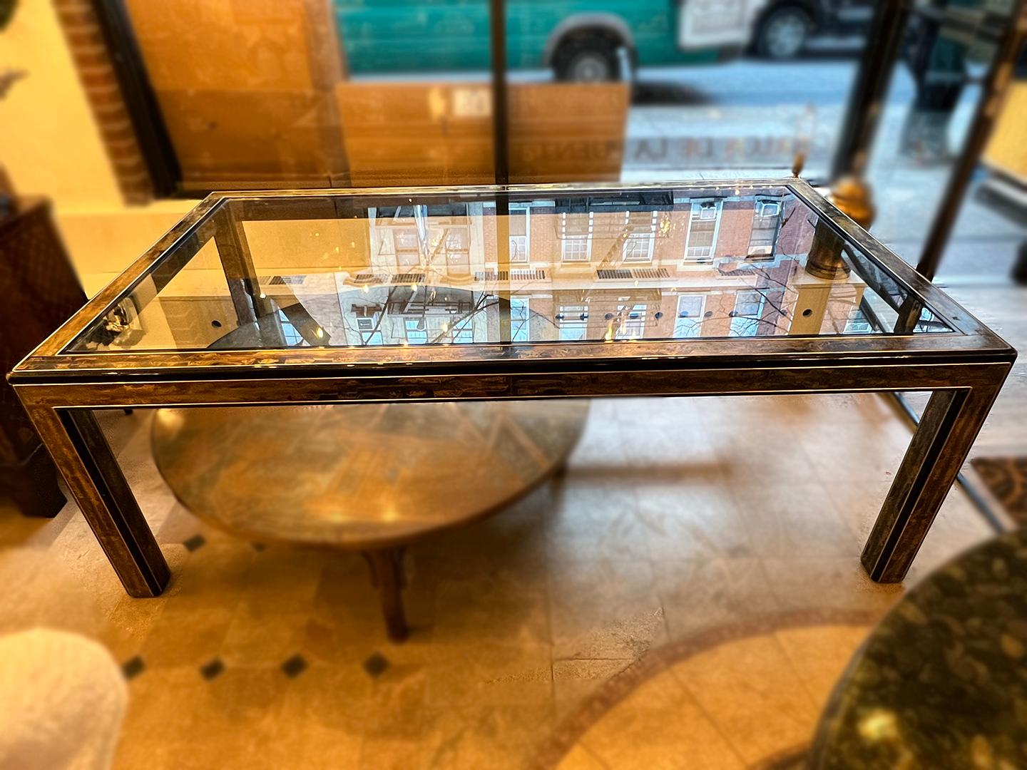 A circa 1960's metal inlay and glass Rohne dining table.

Measurements:
Height: 30