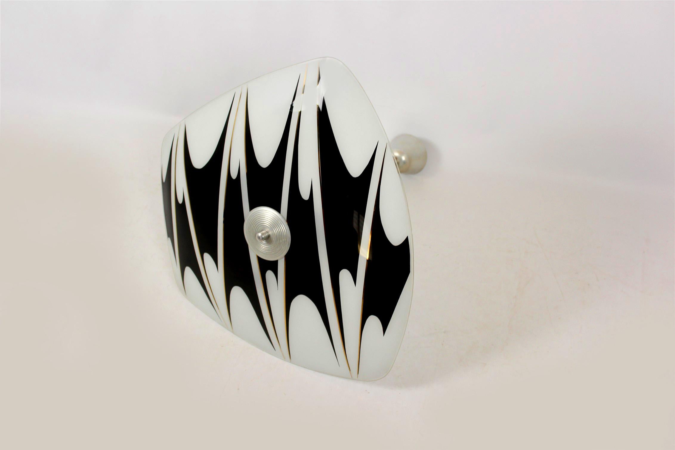 Beautiful ceiling light dating from the 1950s or 1960s. Made in former Czechoslovakia by Napako. Features a patterned glass shade. The lamp is fully functional and requires three E27 bulbs.