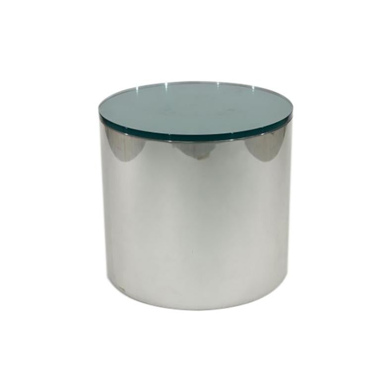 This vintage midcentury Paul Mayen for Habitat and Architectural Supplements cylinder drum side table is circa 1970. It has a Minimalist design with clean, geometric lines and features a chrome-plated steel base and a solid glass top. Original