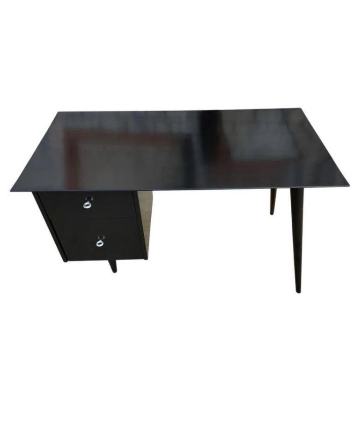 Beautiful Paul McCobb planner group #1560 double drawer desk Black Lacquer on maple with aluminum ring knobs solid maple. Desk is in great condition. Very beautiful designed desk on tapered legs - all solid maple. Drawers slide smooth and clean