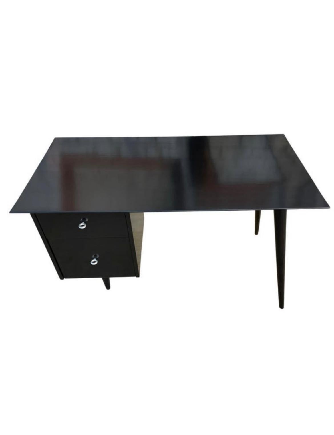 Beautiful Paul McCobb planner group #1560 double drawer desk Black Lacquer on maple with aluminum ring knobs solid maple. Desk is in great condition. Very beautiful designed desk on tapered legs - all solid maple. Drawers slide smooth and clean
