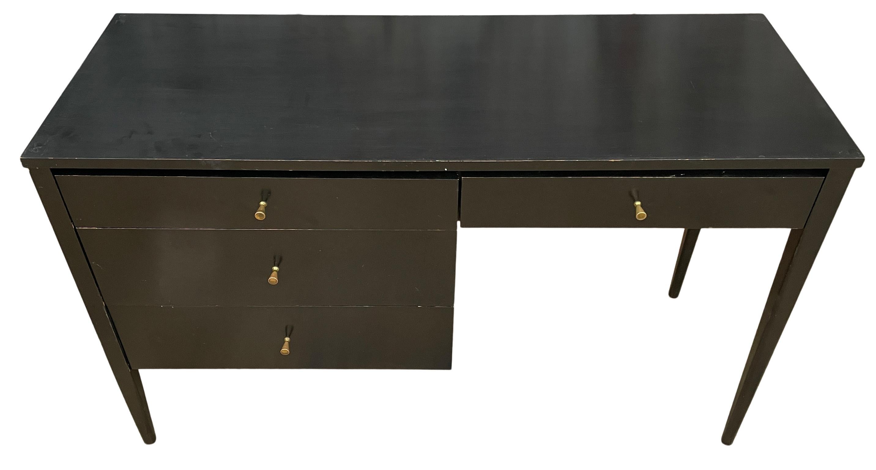 Beautiful Paul McCobb Planner Group #1567 four drawer desk solid maple black finish brass pulls solid maple. Desk is in original vintage condition. Very beautiful designed desk on straight legs - all solid maple. Designed by Paul McCobb - Built by