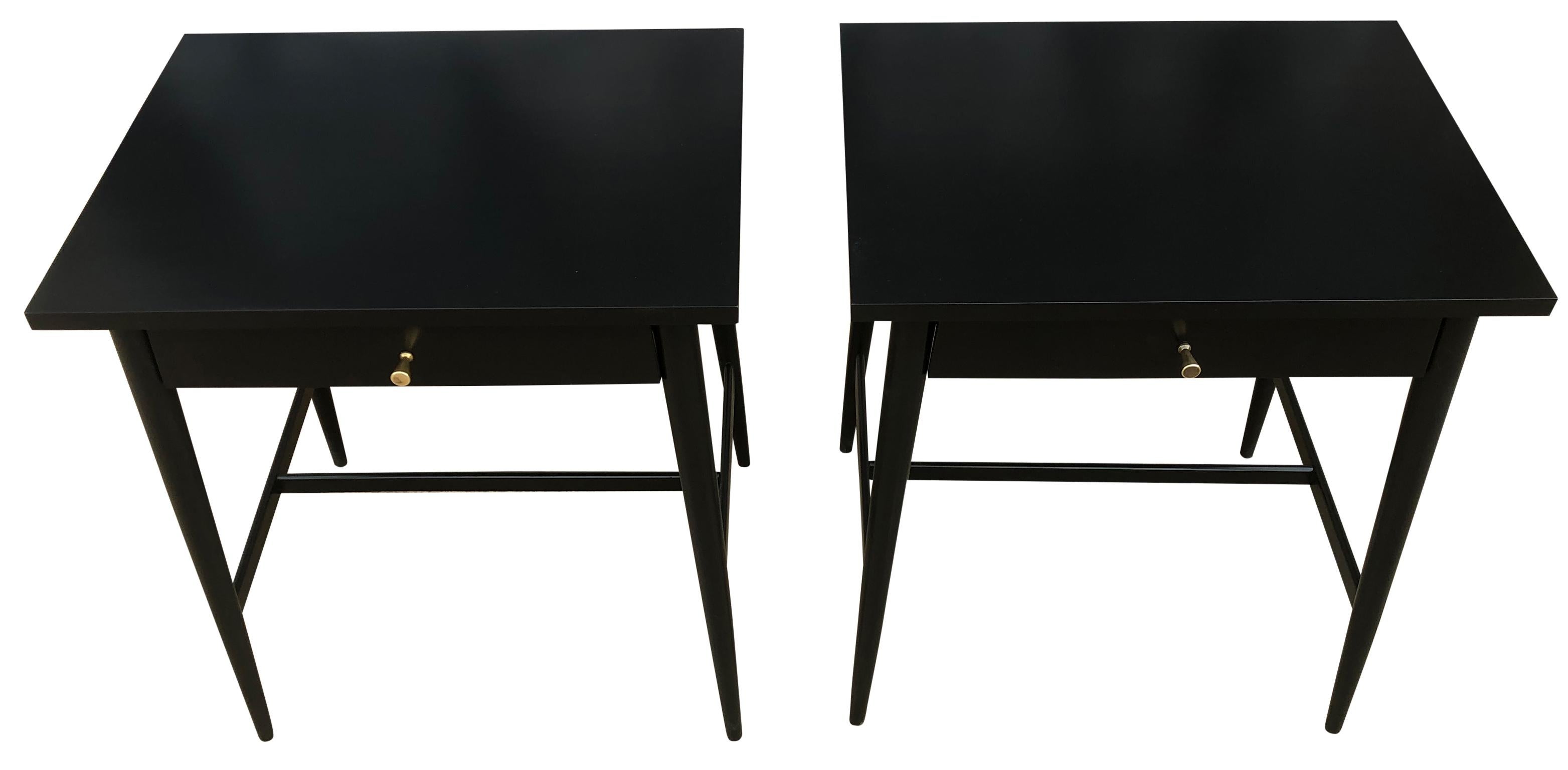 Beautiful pair of Paul McCobb Planner Group #1586 maple nightstands lamp tables single drawer Planner Group brass knobs Minimalist refinished in black lacquer, professionally sprayed. Very delicate designed pair of nightstands with tapered legs,