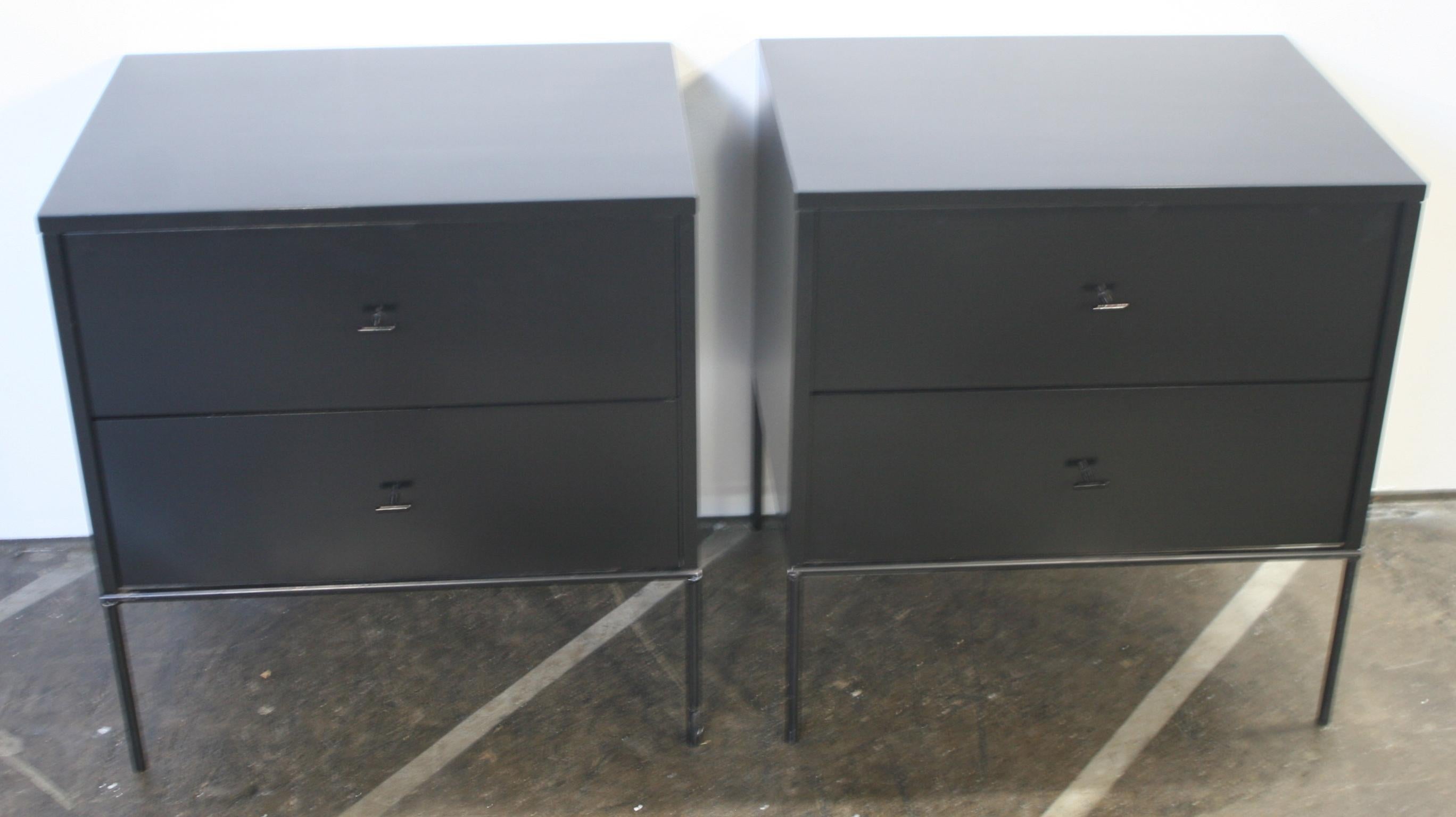 Beautiful pair of Paul McCobb early 1950s production #1503 maple nightstands end tables double-drawer Planner Group. Black T pull knobs. Refinished in black lacquer professionally sprayed. Very modern designed pair of nightstands with Iron Base with