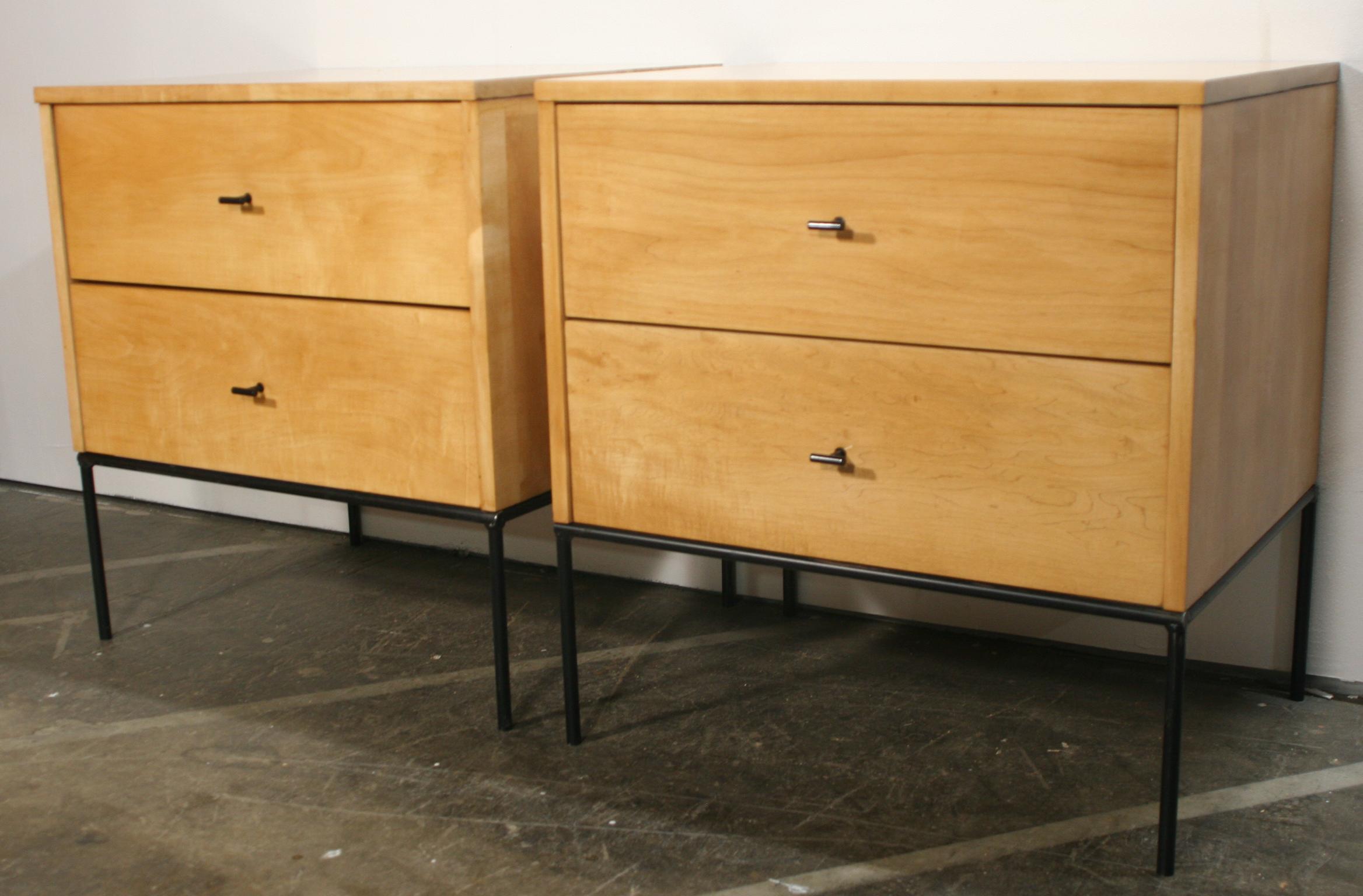 Beautiful pair of Paul McCobb 1950s #1503 blonde maple nightstands end tables double-drawer planner Group. Black steel T pull knobs. Refinished in blonde lacquer. Very modern designed pair of nightstands with iron base with 4 legs. All solid maple.