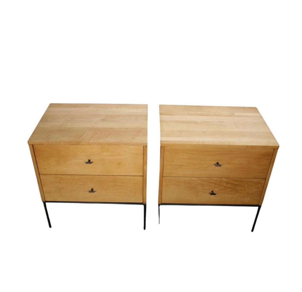 Beautiful pair of Paul McCobb 1950s #1503 blonde maple nightstands end tables double-drawer planner Group. Black steel T pull knobs. Refinished in raw blonde maple with clear lacquer. Very modern designed pair of nightstands with iron base with 4