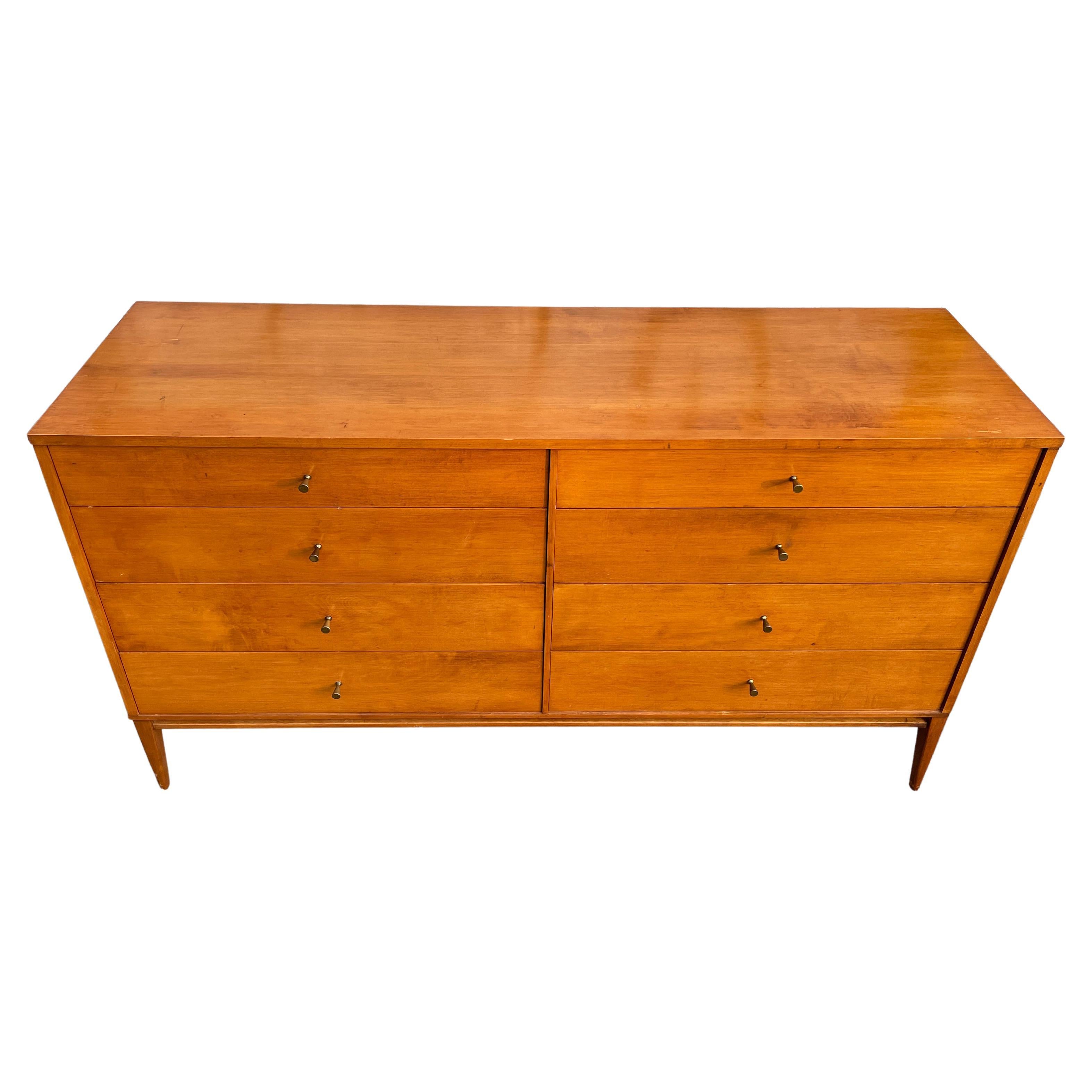 Vintage Mid century Paul McCobb 8-drawer dresser credenza Planner Group #1507. Beautiful dresser by Paul McCobb circa 1950s Planner Group 8-drawer Blonde Maple finish over solid maple polished Brass cone pulls with solid maple base. Original Burn