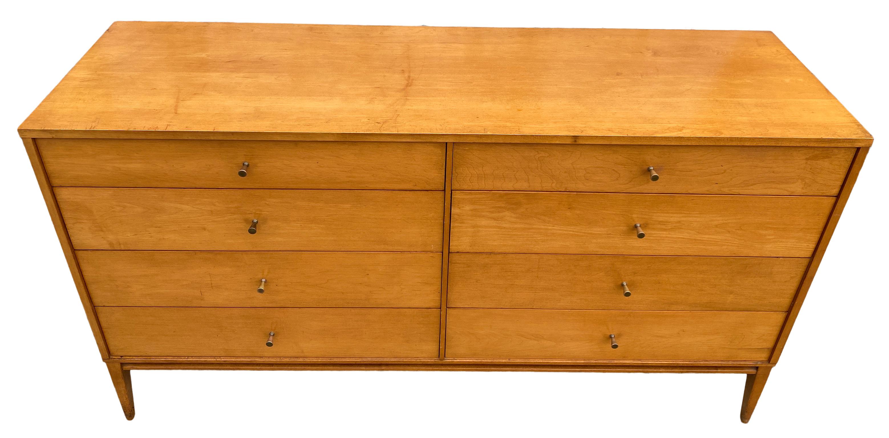 Vintage midcentury Paul McCobb 8-drawer dresser credenza planner group #1507. Beautiful dresser by Paul McCobb, circa 1950s planner group, 8-drawer, solid maple, brass cone pulls. Solid maple original base. Original foil label, clean inside and out.