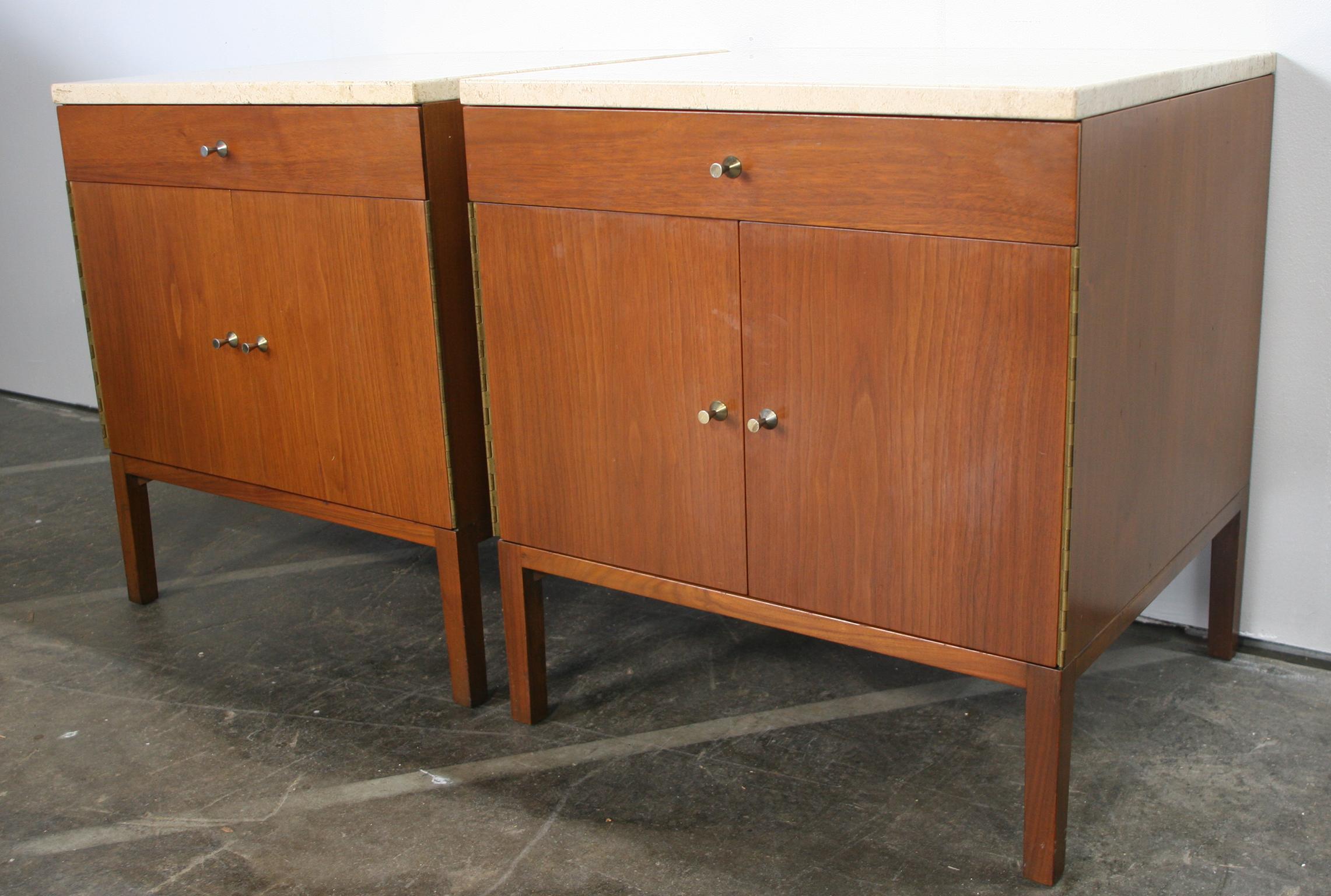 Beautiful pair of Paul McCobb 1960s Production #7700 light walnut nightstands end tables with roman travertine stone tops. Has single-drawer with lower cabinet that has 1 adjustable shelf. Solid Brass hinges and details Original Vintage Condition.