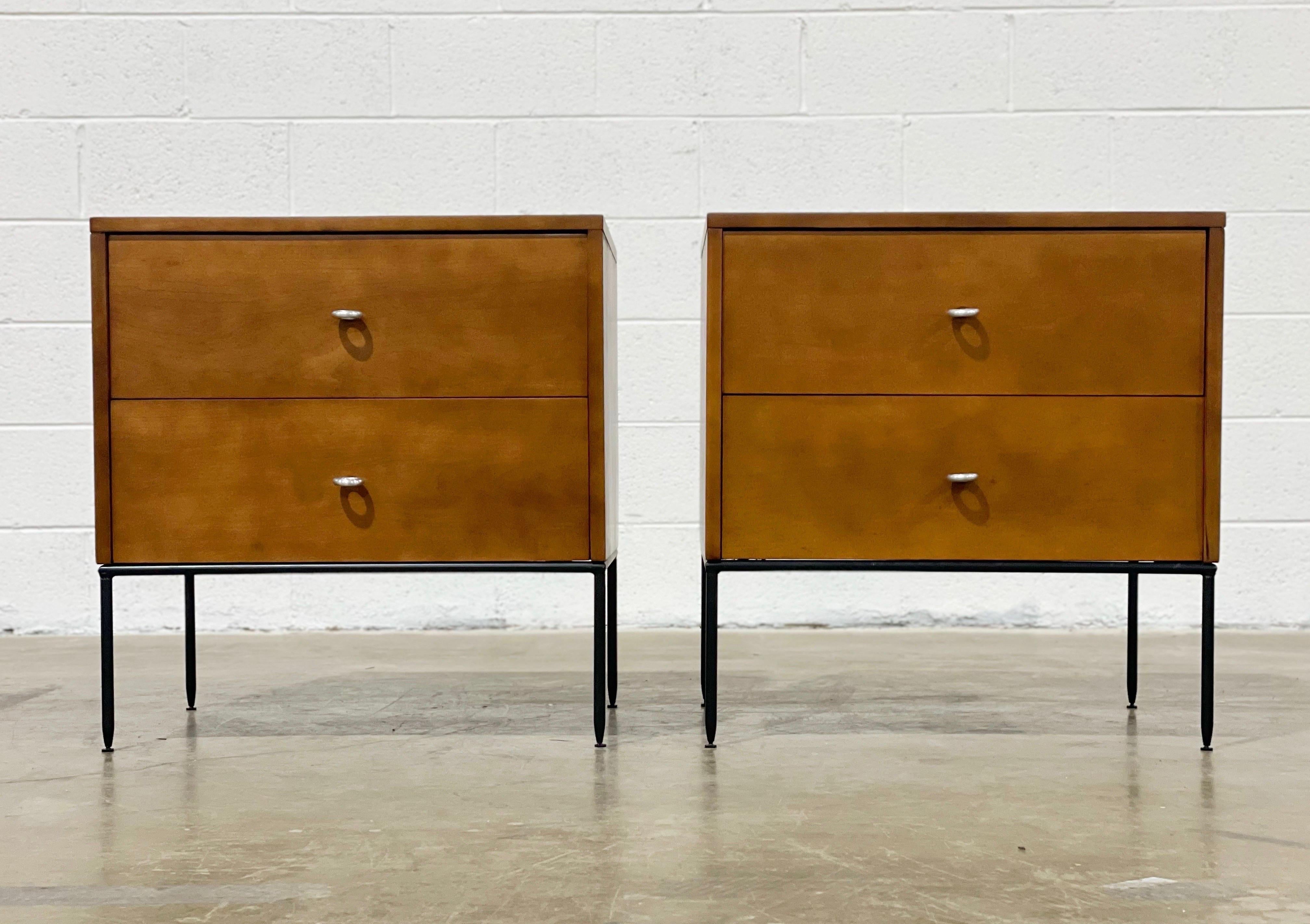 Stellar pair of American modern two drawer Planner Group nightstands by Paul McCobb for Winchendon.
- Model #1503
- Tobacco finish
- Wrought Iron bases with adjustable feet
- Large O-Ring pulls

Fully restored by our team of in-house