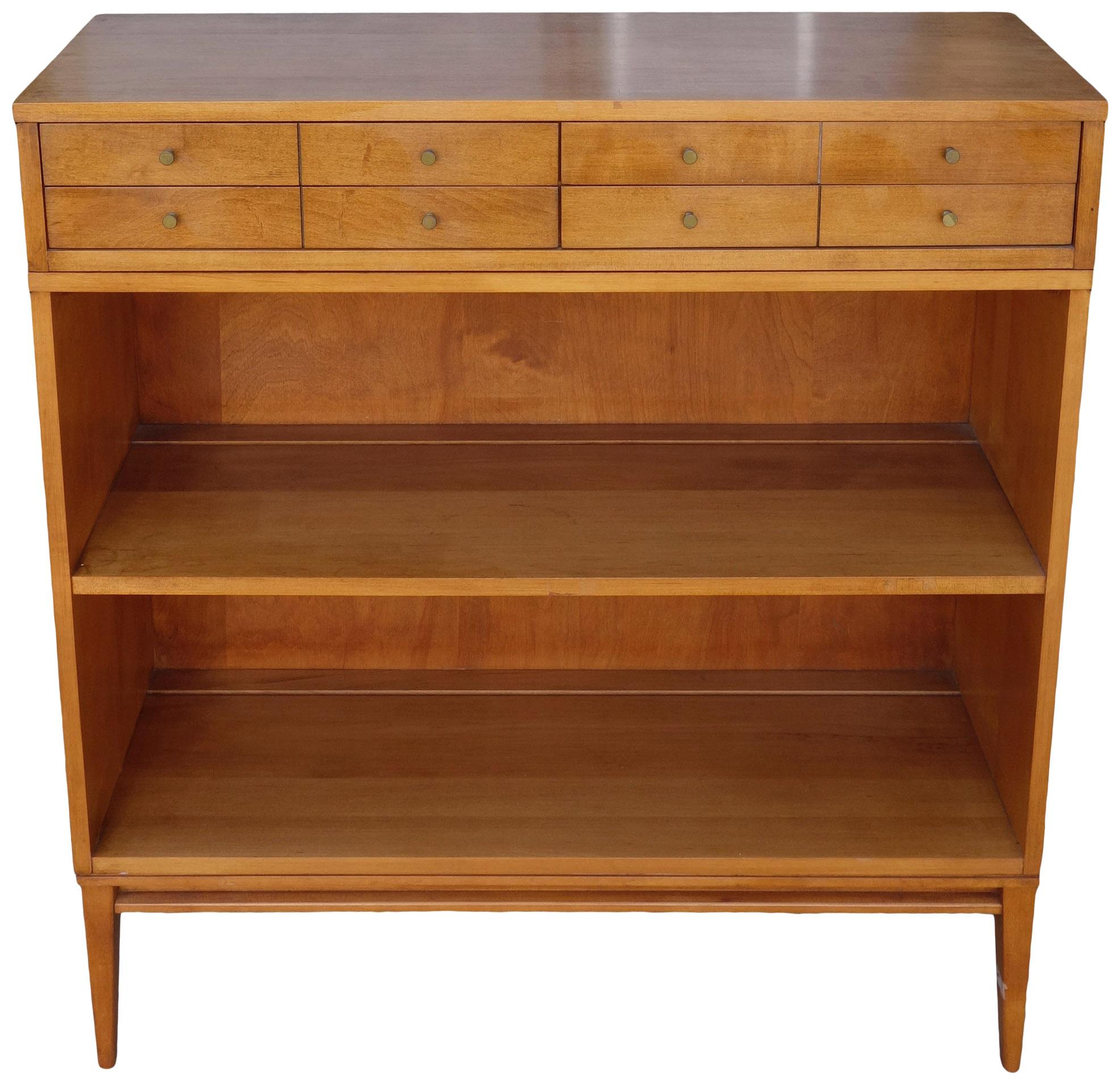 Vintage midcentury Paul McCobb single bookcase #1516 solid maple with original tobacco finish on wood base. Beautiful bookcase by Paul McCobb, circa 1950s Planner Group, single center shelf fixed position, solid maple construction. Included is the