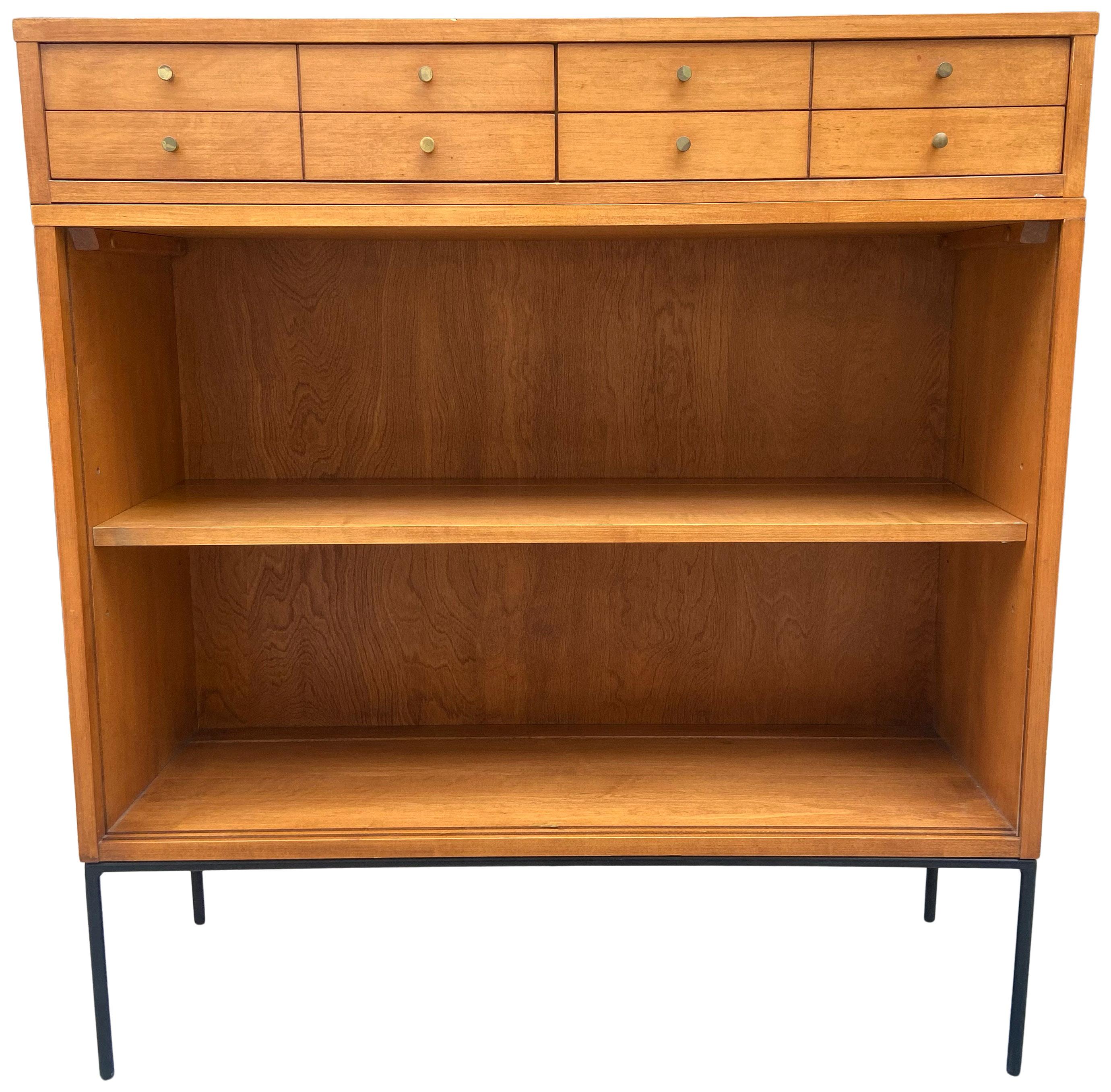 Vintage midcentury Paul McCobb single bookcase #1516 or display cabinet. Solid maple with original tobacco finish on iron base. Beautiful bookcase by Paul McCobb, circa 1950s Planner Group, shelf with adjustable positions, solid maple construction.