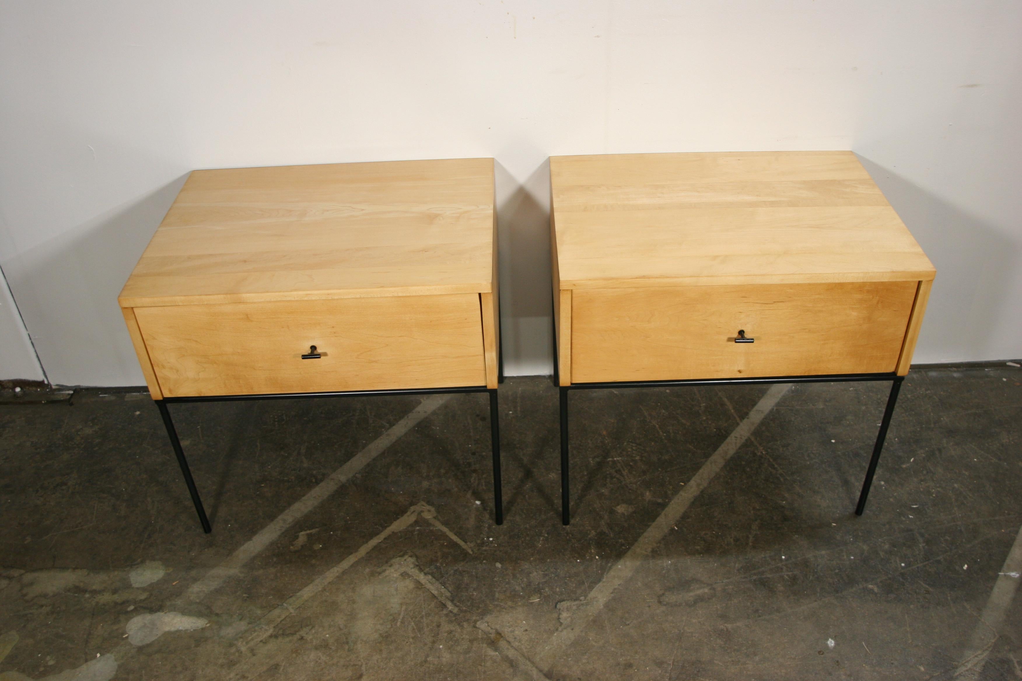 Beautiful pair of Paul McCobb Planner Group #1500 maple nightstands end tables single drawer. Black T pull knobs. Refinished in raw blonde maple. Very modern designed pair of nightstands with Iron Base with 4 legs. all solid maple. You are buying