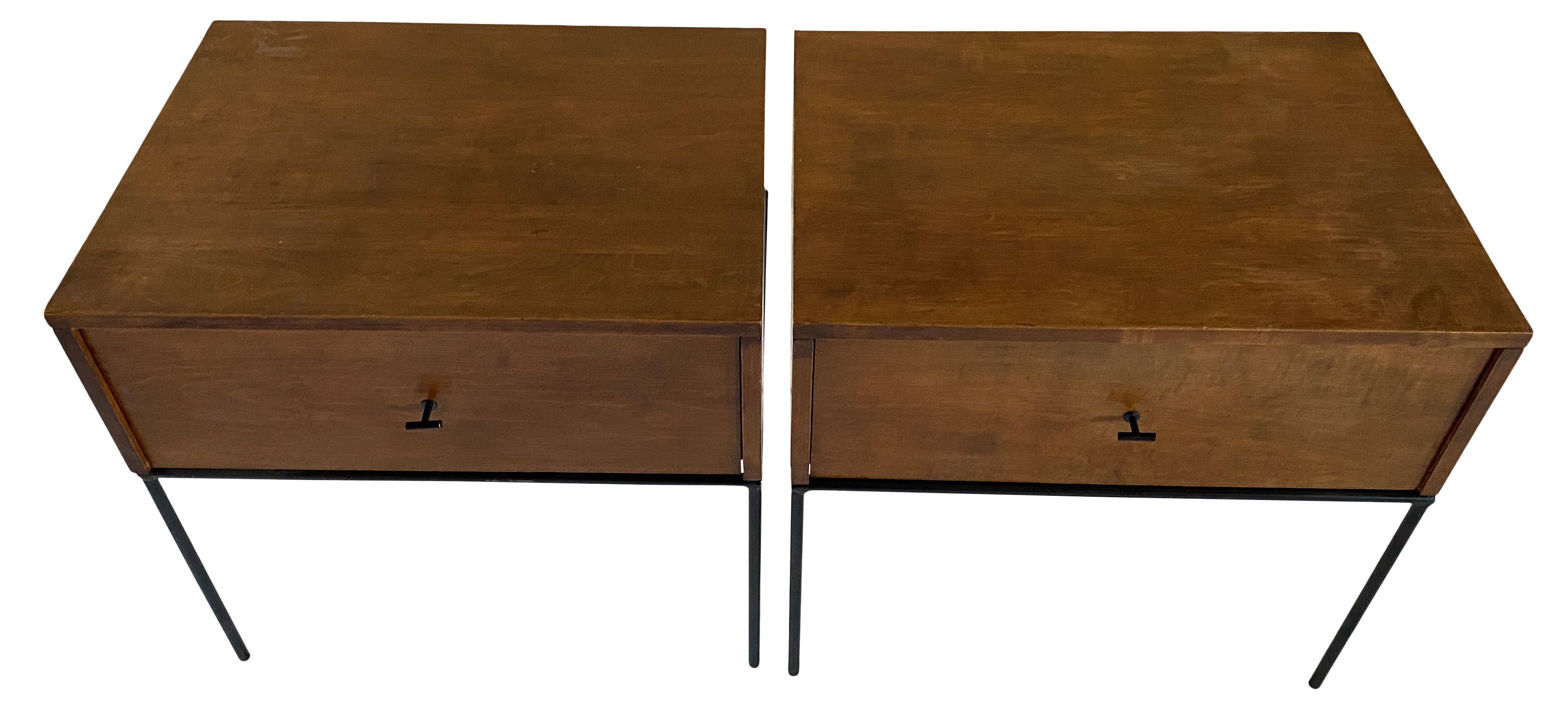 Beautiful pair of Paul McCobb Planner Group #1500 maple nightstands end tables single drawer. Black T pull knobs. Original vintage condition with walnut brown finish on maple. Very modern designed pair of nightstands with Iron Base with 4 legs. All