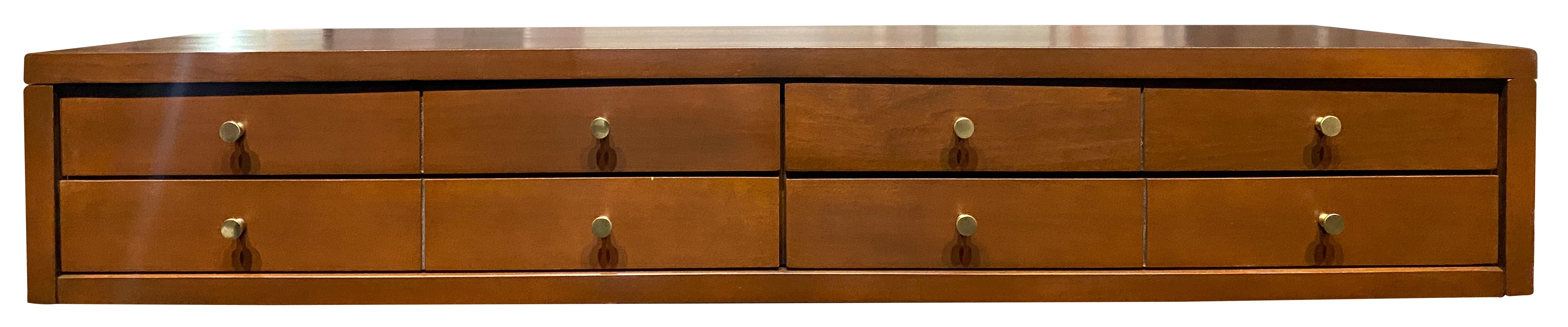 Nice Paul McCobb 3' small jewelry box in solid maple construction with brown finish. Very high quality construction with original brass pulls. Made for top of dresser or bookcase. 8 brass knobs 4 drawers. Planner Group, Winchendon Mass. Refinished