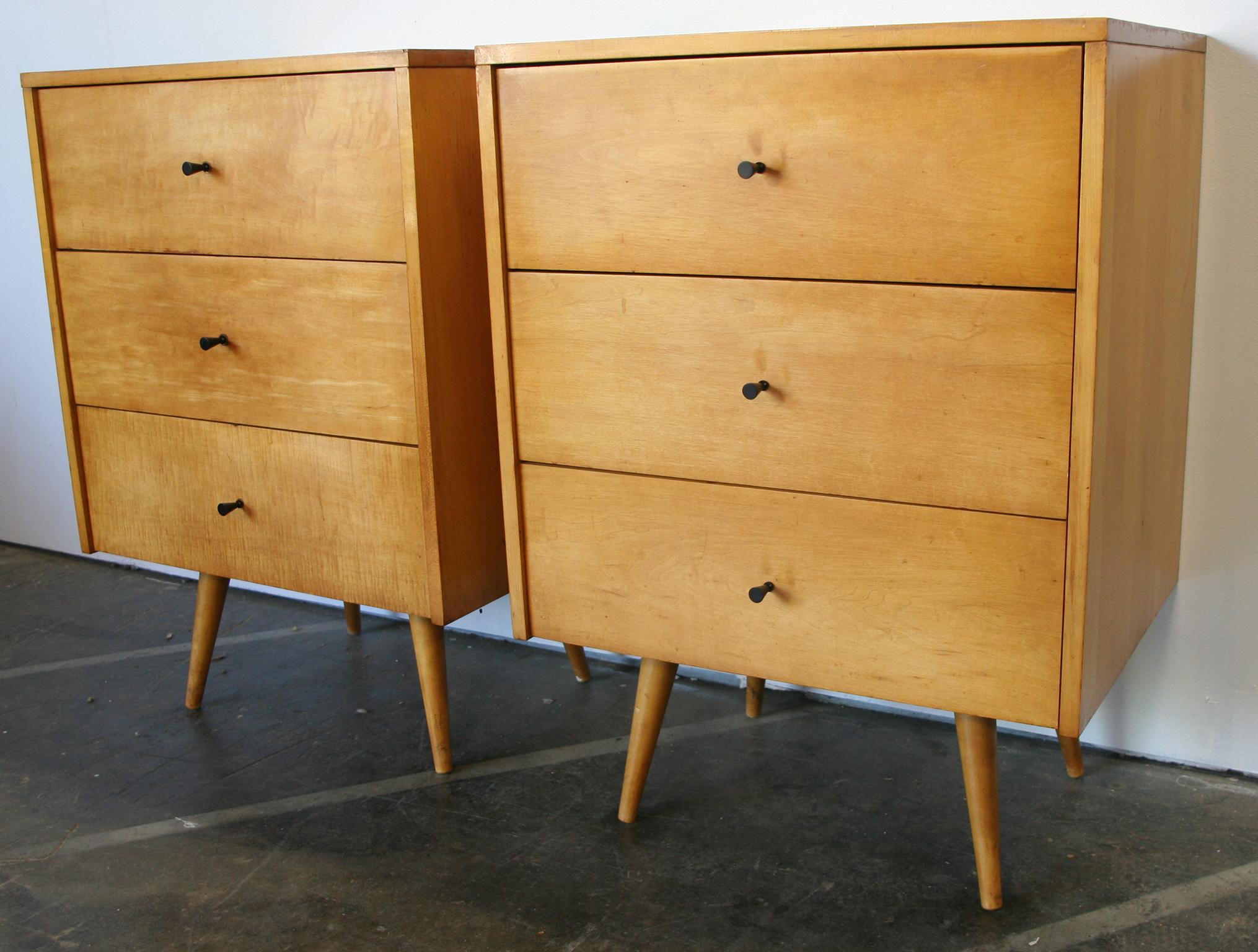Beautiful clean pair of Paul McCobb Planner Group #1506 maple nightstands end tables triple-drawer. Black cone pull knobs. Original Raw blonde maple in good vintage condition. Very modern designed pair of nightstands with 4 tapered solid maple legs.