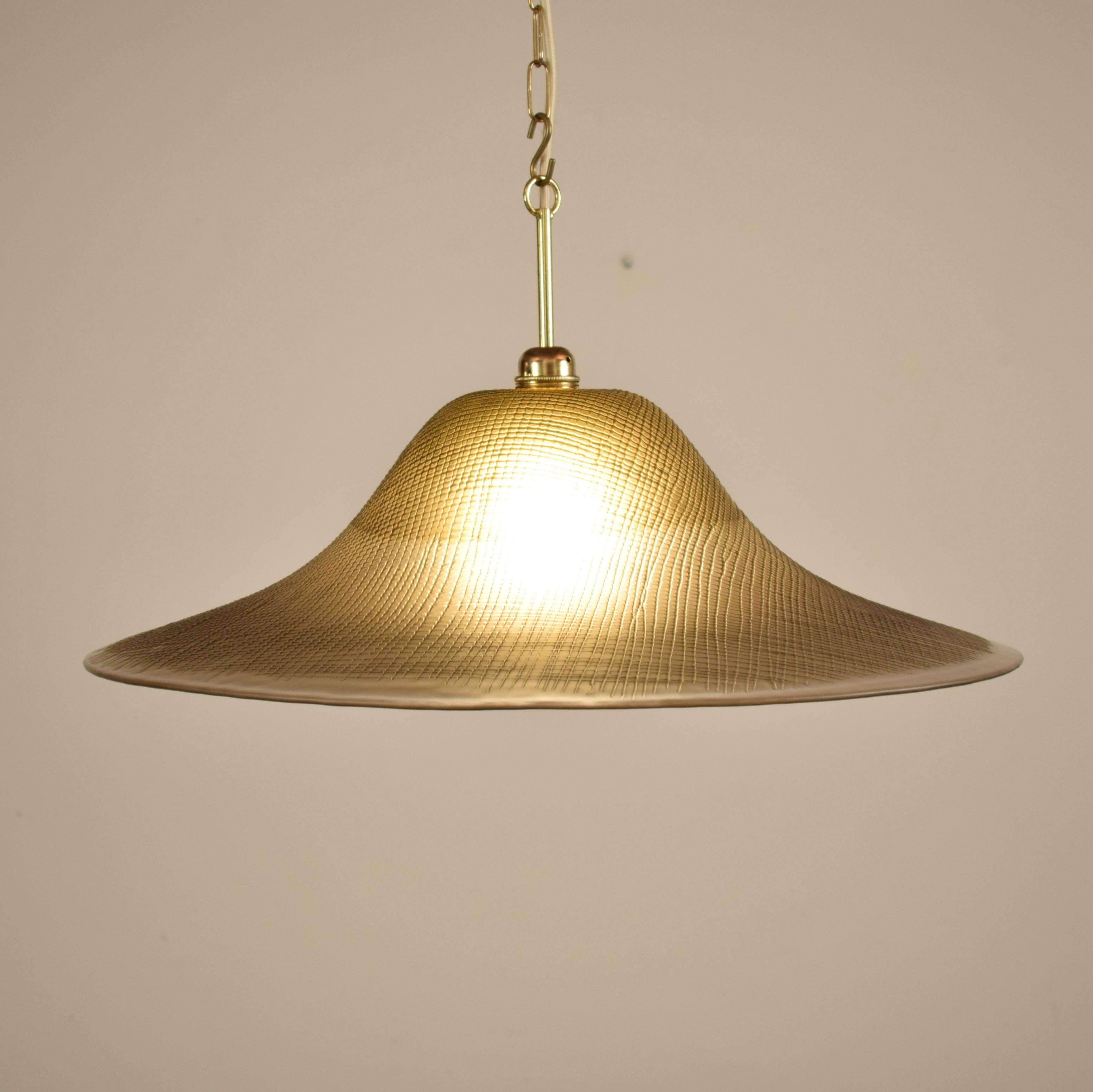 This midcentury Peill and Putzler ceiling lamp is made out of texture glass.