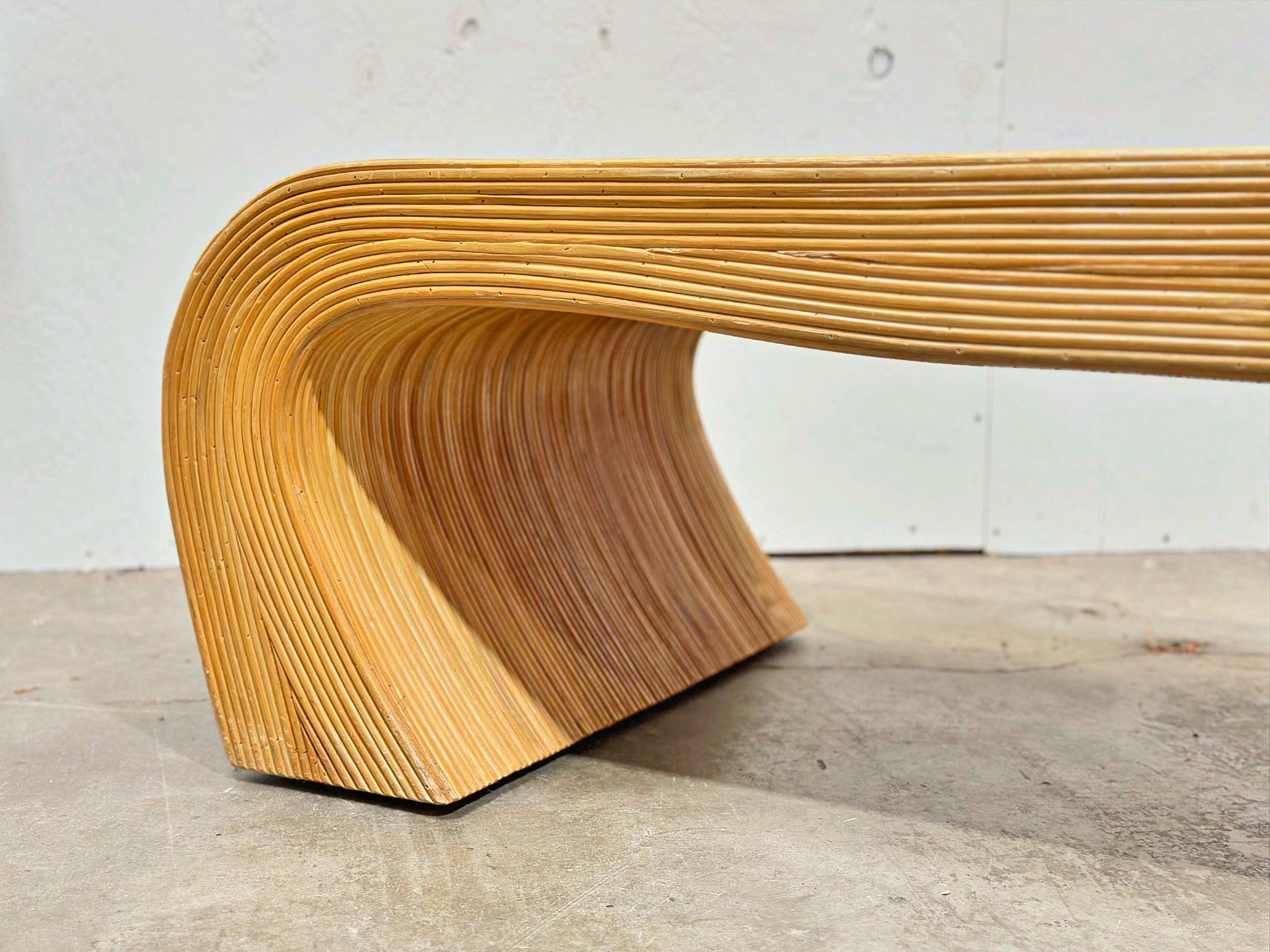Vintage organic midcentury modern split reed cocktail table. Gorgeous silouhette. Sculpted circle design adds movement to the piece.
Excellent condition - looks to have bee hardly, if ever used. No flaws of note. This piece was deep cleaned and