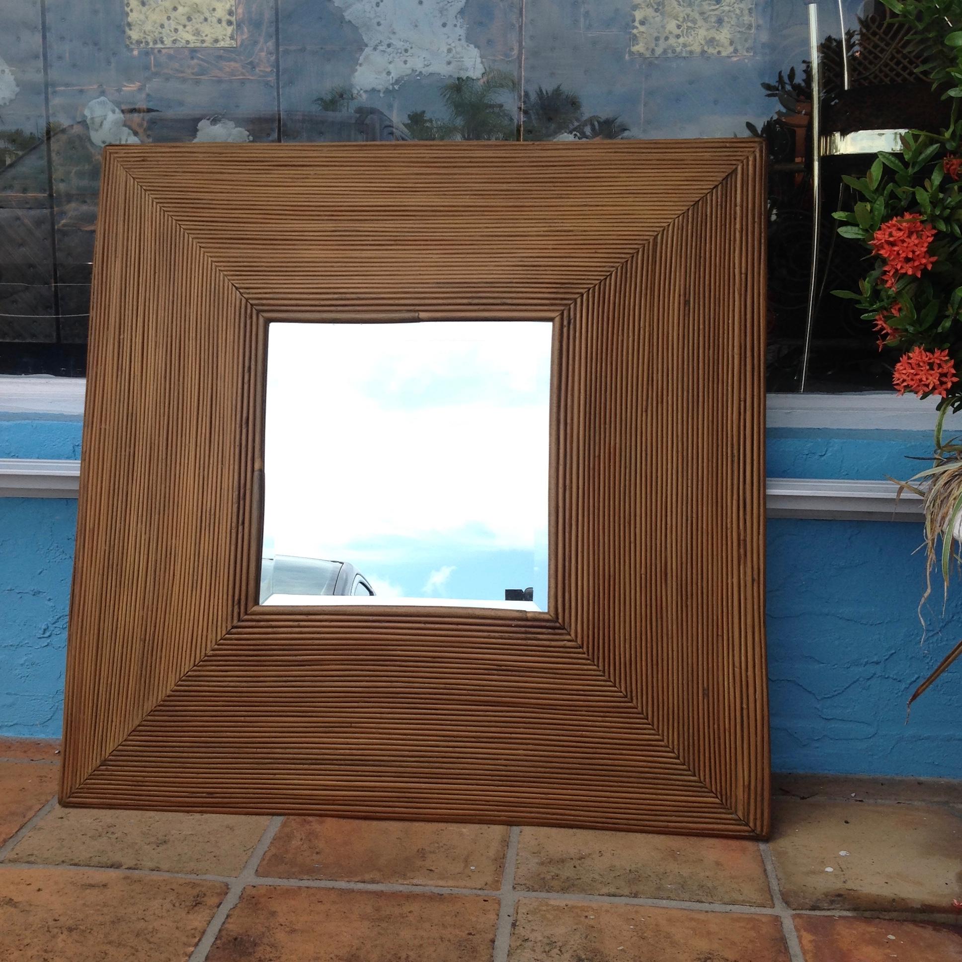 Dramatic design with flared out sides. The deep beveled mirror is original.
