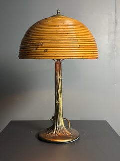 Midcentury pencil reed rattan bamboo and brass table lamp. 1970s