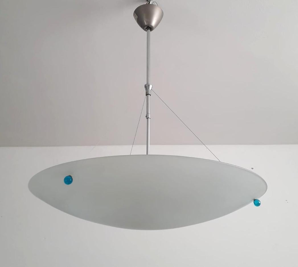 Vintage Italian pendant with a large frosted glass shade suspended with three blue glass balls on nickel frame / Made in Italy by Fontana Arte, circa 1970s
Original sticker on the ceiling canopy
Measures: diameter 27.5 inches, height 31.5 inches
5