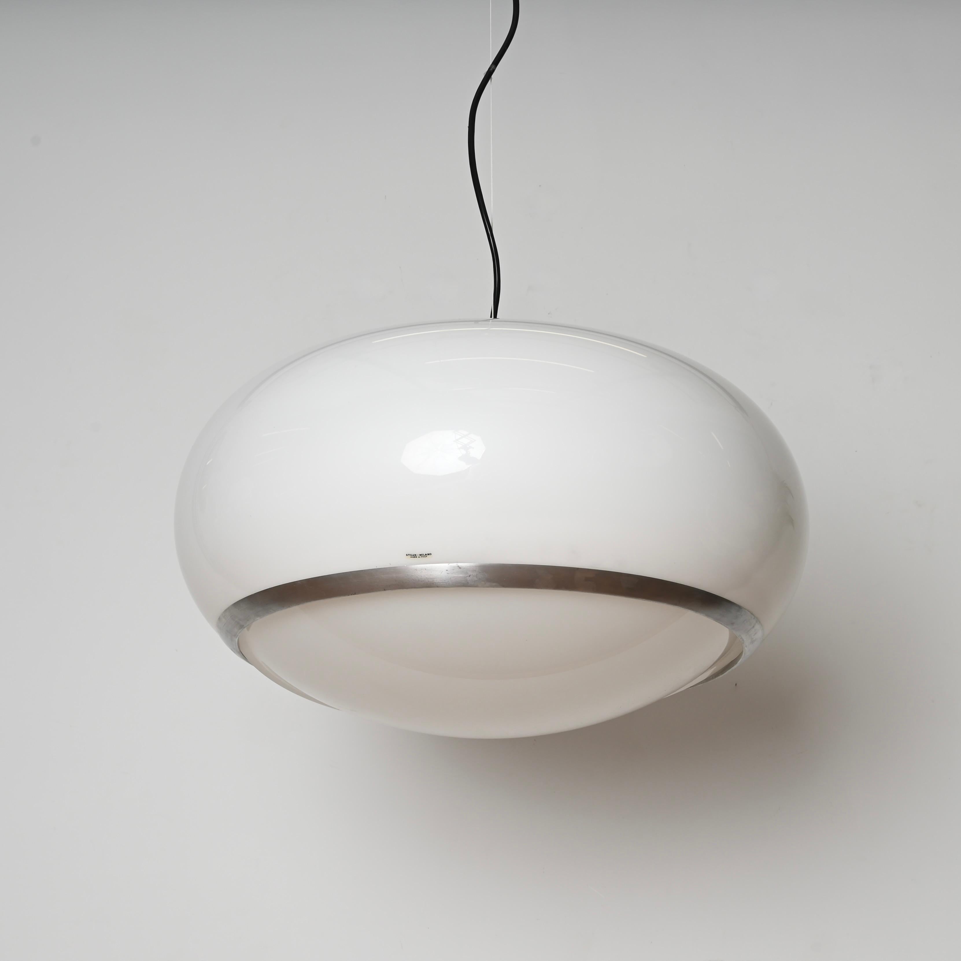 Stunning pendant fully made in white perspex and brushed aluminium. This large suspended light fixture was designed by Stilux Milano, in Italy during the 1960s and still has its original label. 

With an elegant space age design, this unique pendant