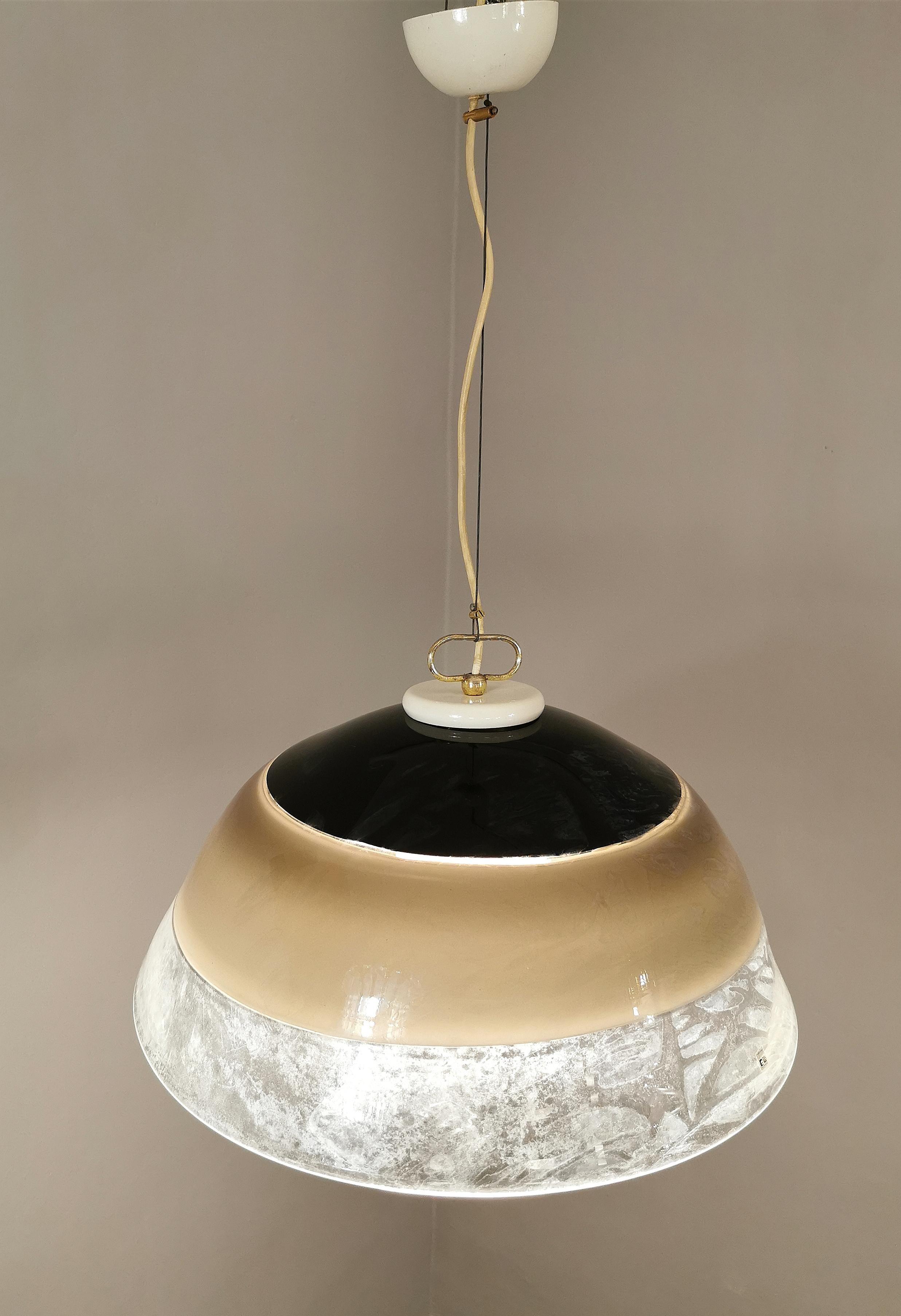 Extraordinary suspension designed in Italy by the Toso brothers and produced by Leucos during the 70s. The large-sized suspension has a 3 incalmo Murano glass, which is one of the most complex processing techniques which consists in the hot coupling