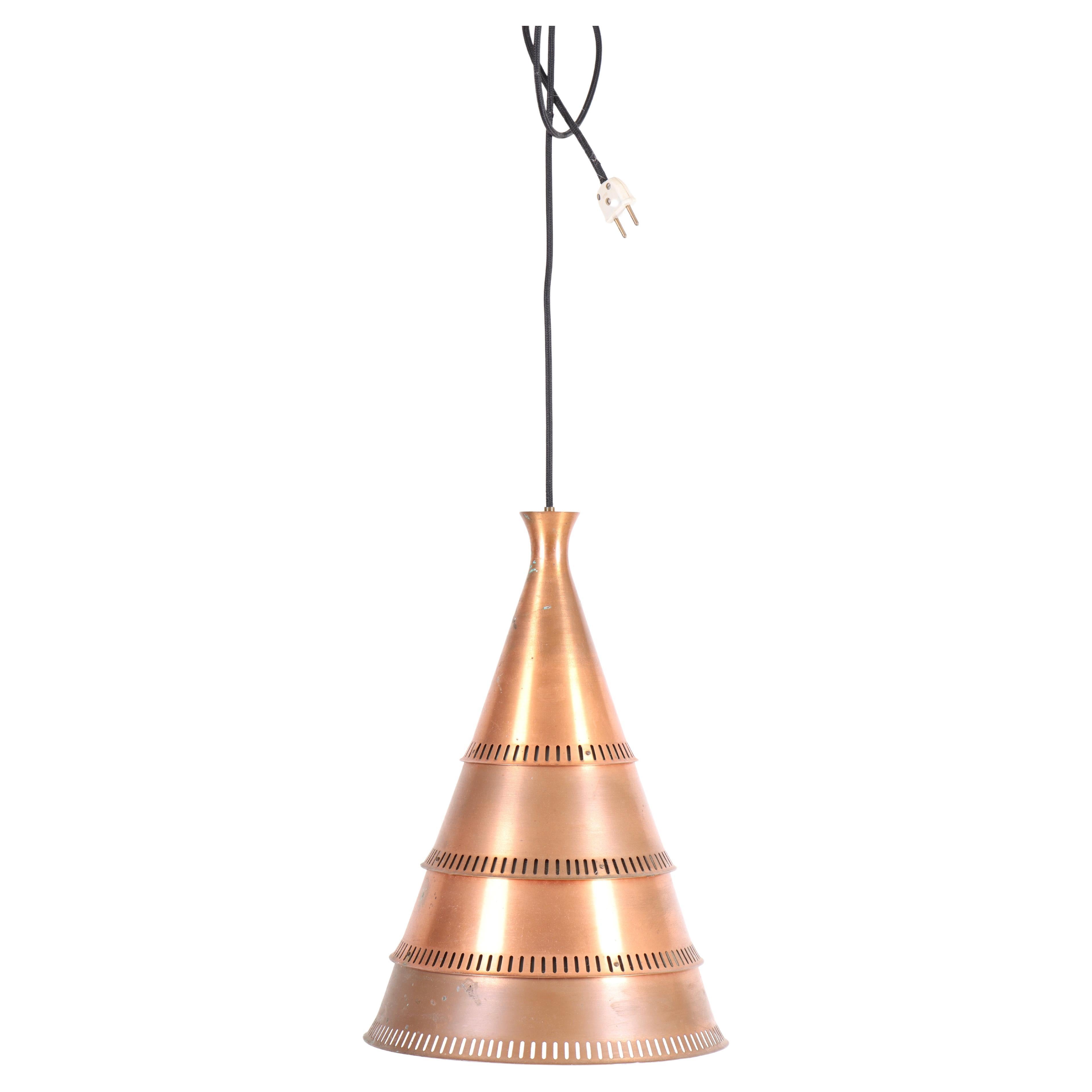 Pendant designed and made in Denmark 1960s. The shade is made in copper. Original condition.