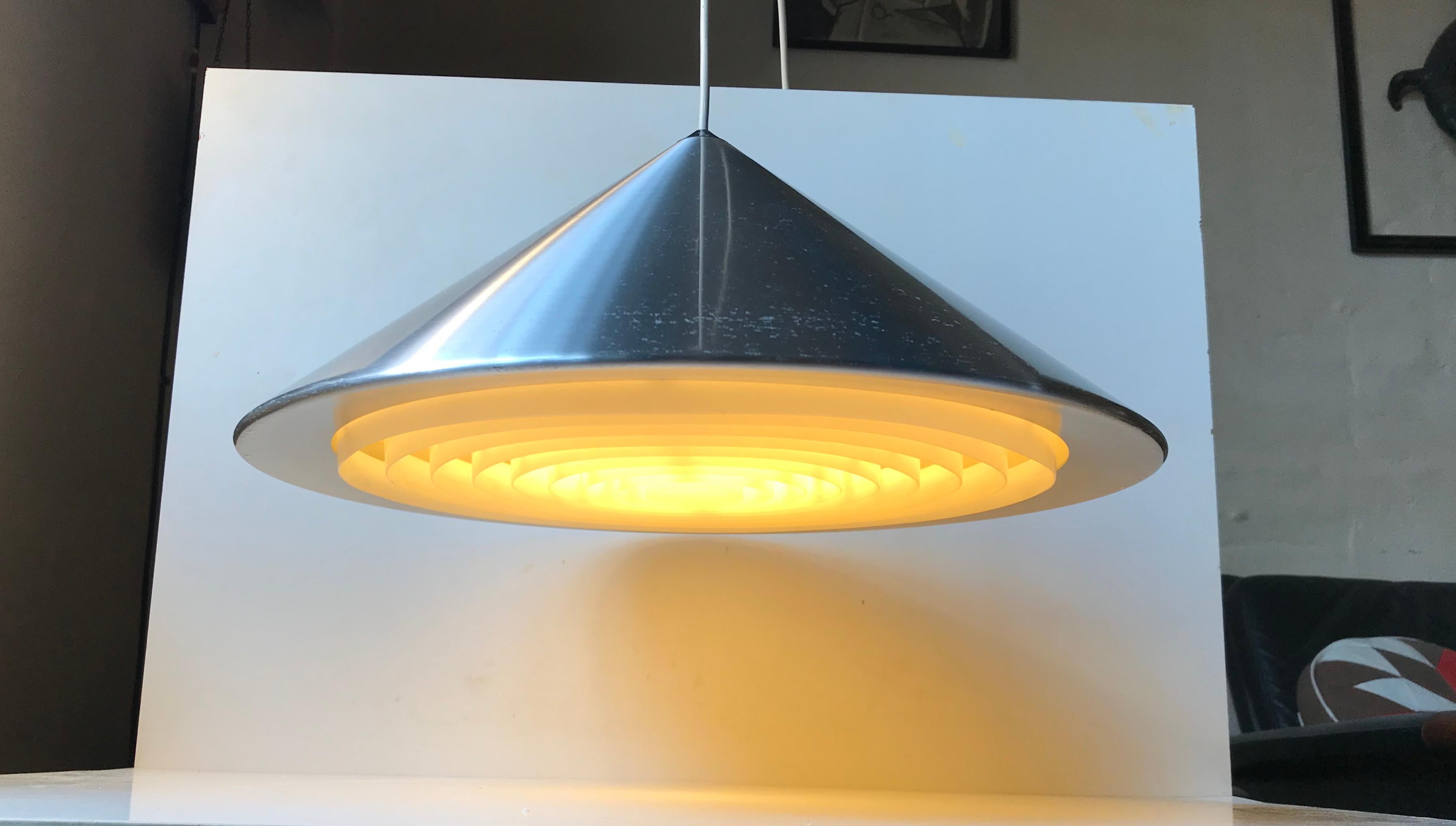 Large conical pendant lamp made from brushed aluminium set with an acrylic shade that distributes and soften the light. Its called 'Classic' and was designed by Jo Hammerborg and manufactured by Fog & Morup in Denmark during the mid-late 1960s.
 