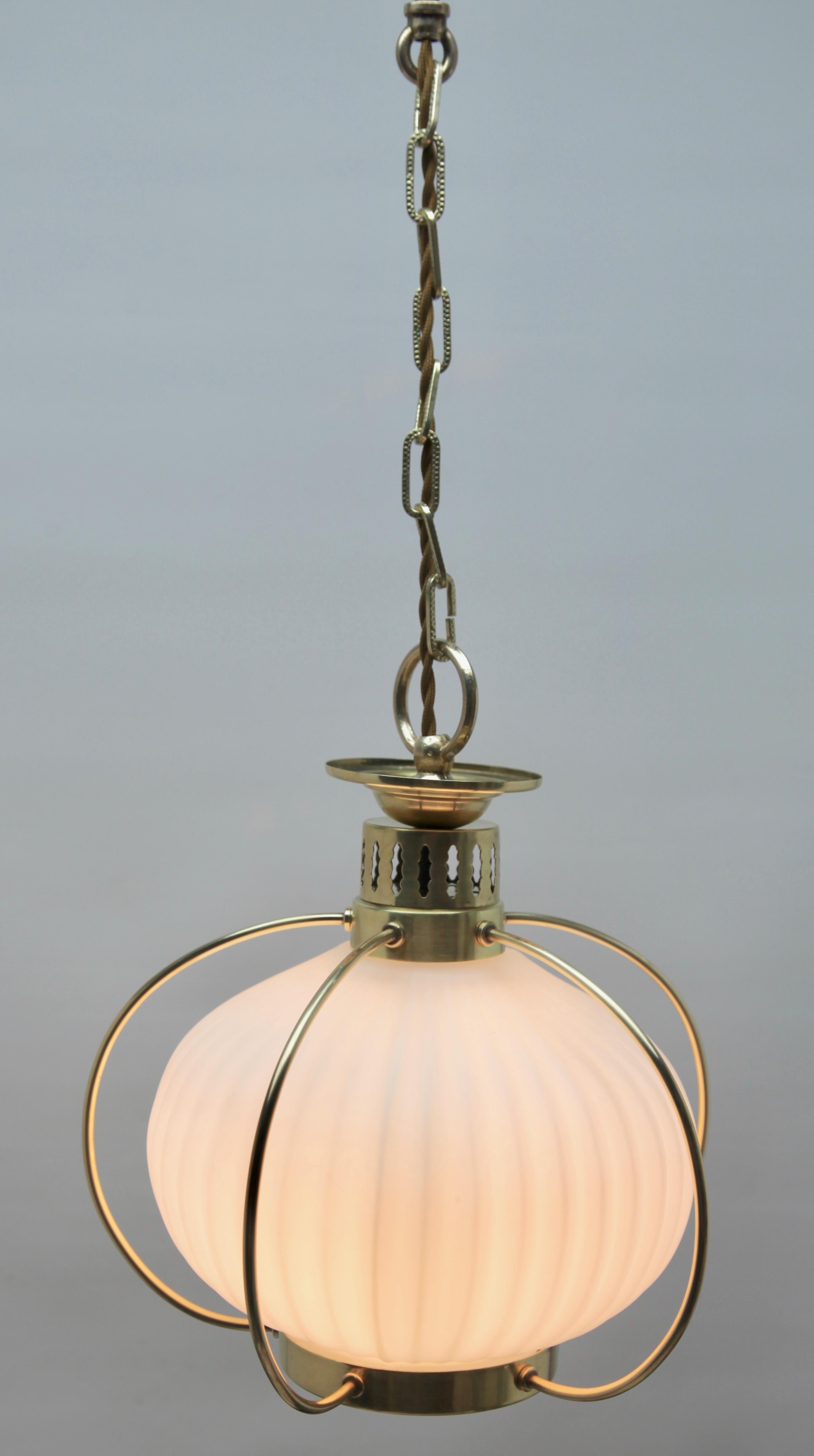 Hanging pendant lights from the late 1950s, designed in the Scandinavian style with an opaline lampshade
Its Classic modernist form and simplicity in design, making it an iconic example of midcentury home lobby lighting.
In excellent condition and