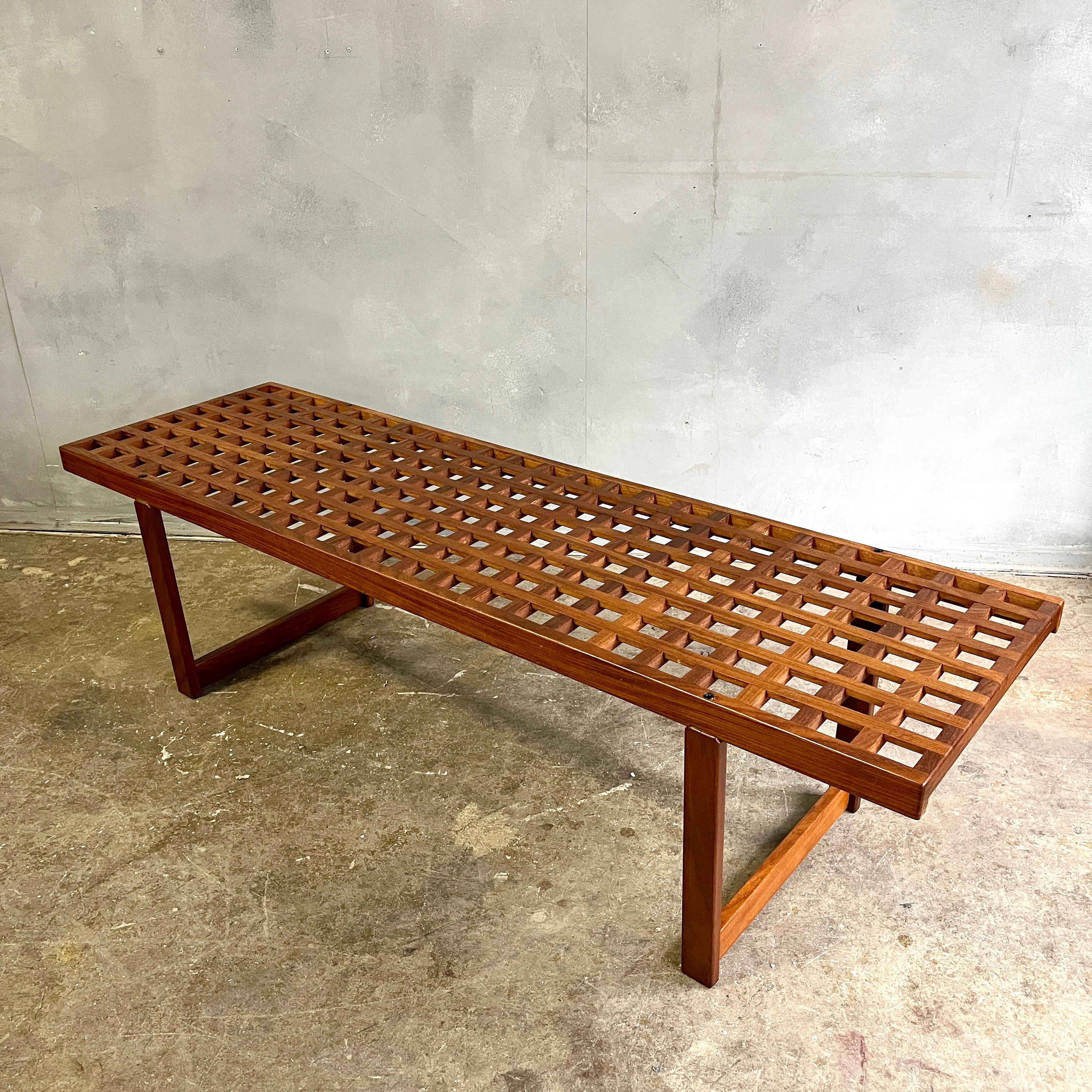 Beautiful slat lattice work bench or coffee table By Peter Loving Nielsen. Wonderful proportions and in excellent vintage condition with a warm teak patina.