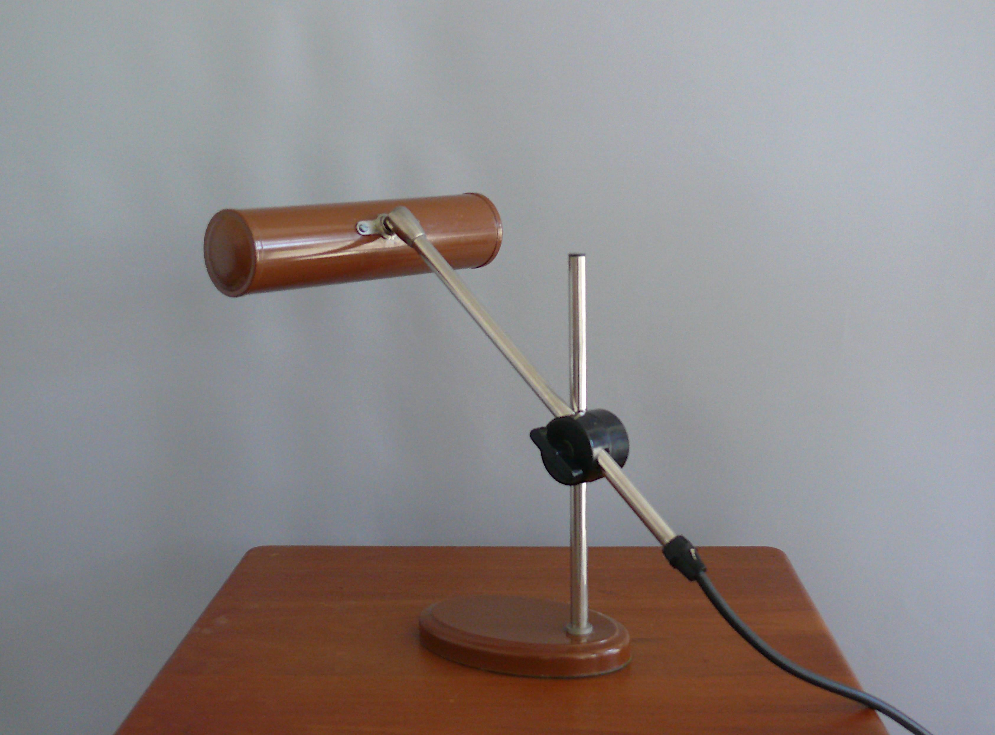 Pfäffle piano/table lamp from the 1960s with a minimalist, modern design. The lamp has a heavy, painted metal base. The chrome-plated lamp arm is extensively adjustable via a disc joint - see pictures. The shade, also painted, is adjustable via a