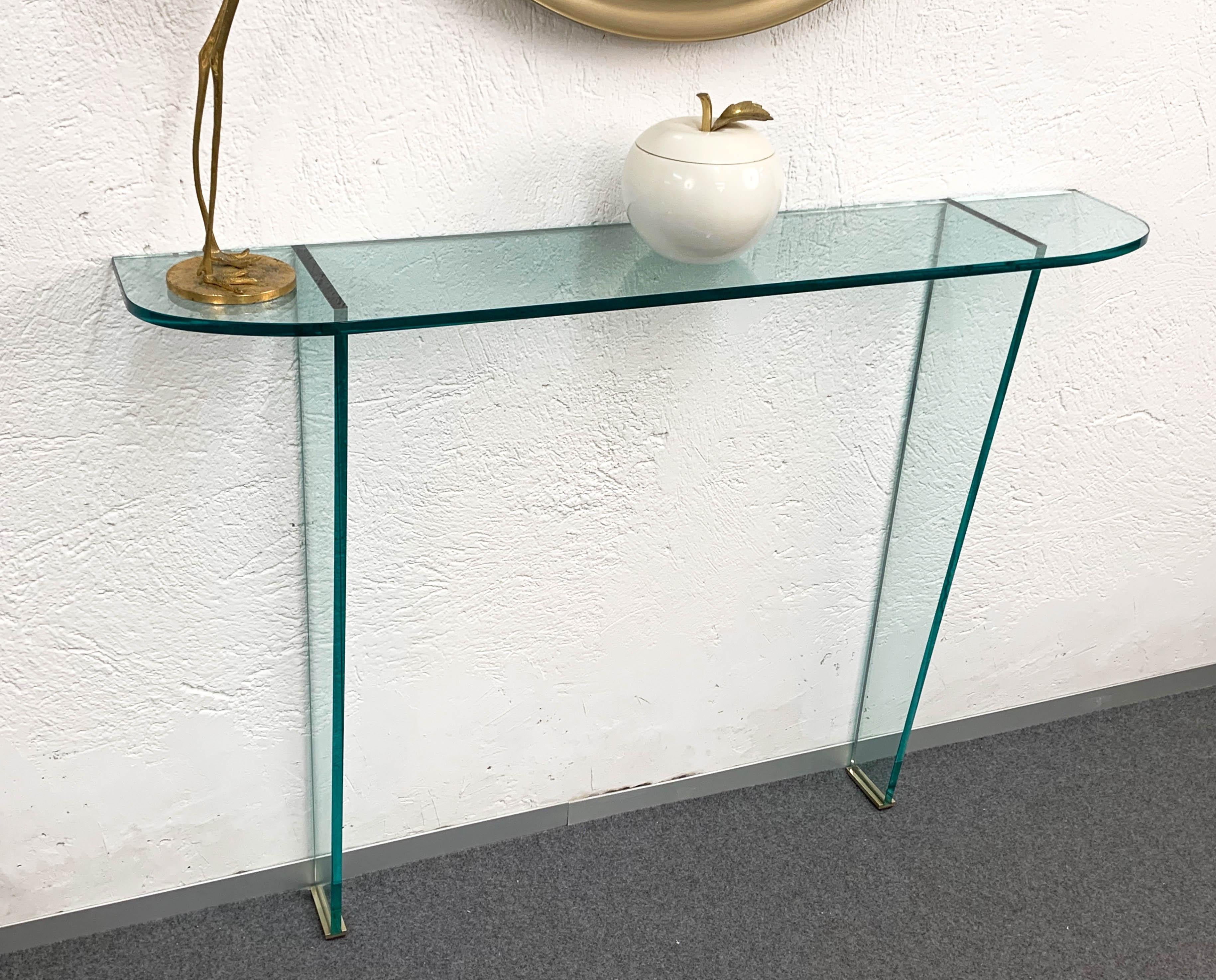 Wonderful midcentury glass console attributed to Pietro Chiesa for Fontana Arte. 

The inner elegance of this astonishing piece is given by the glass composition purity mixed with the brass finishes.

This item is a timeless classic that will