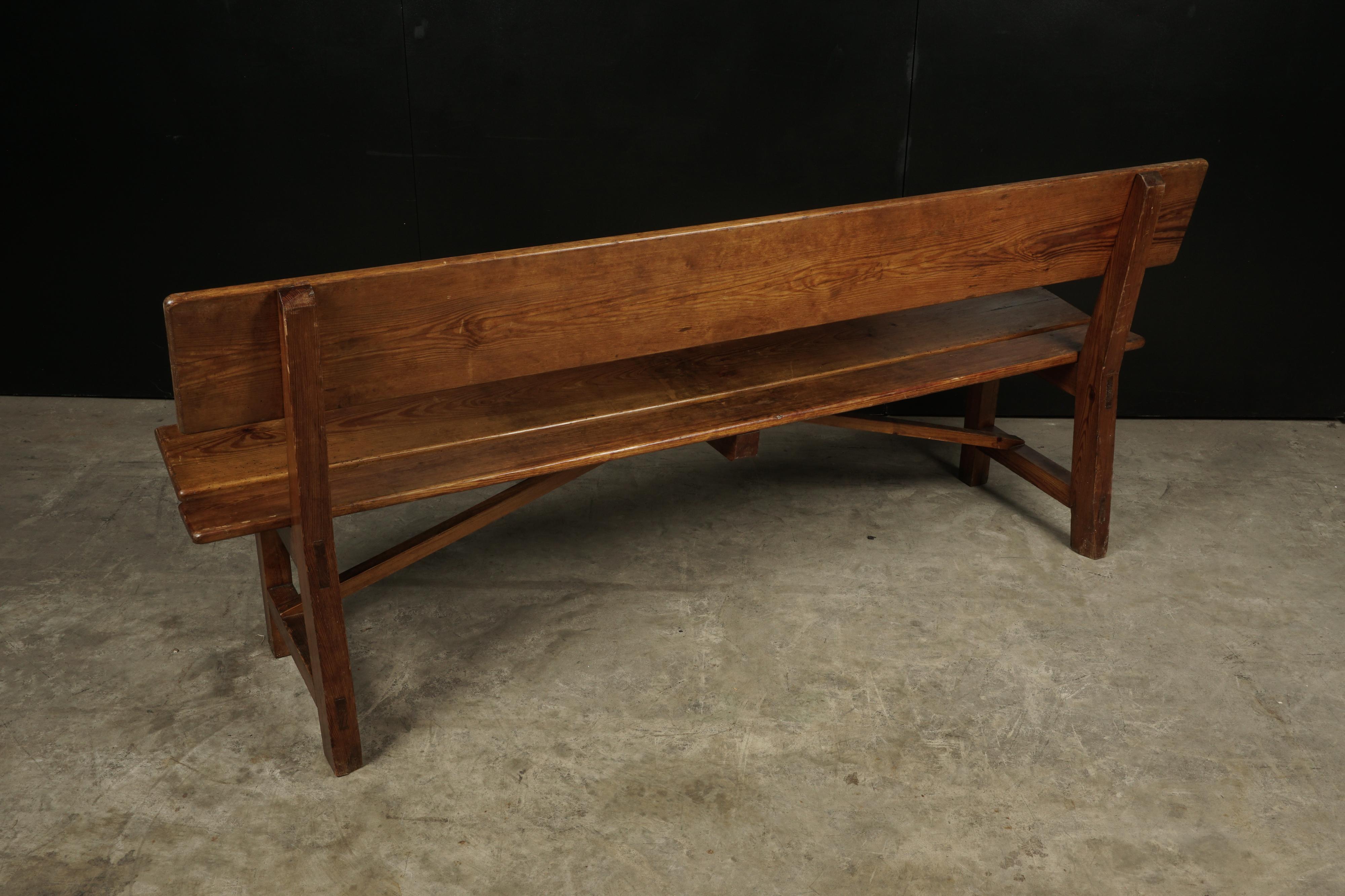 Midcentury pine bench from France, circa 1970. Rare model of solid pine with nice patina and wear.