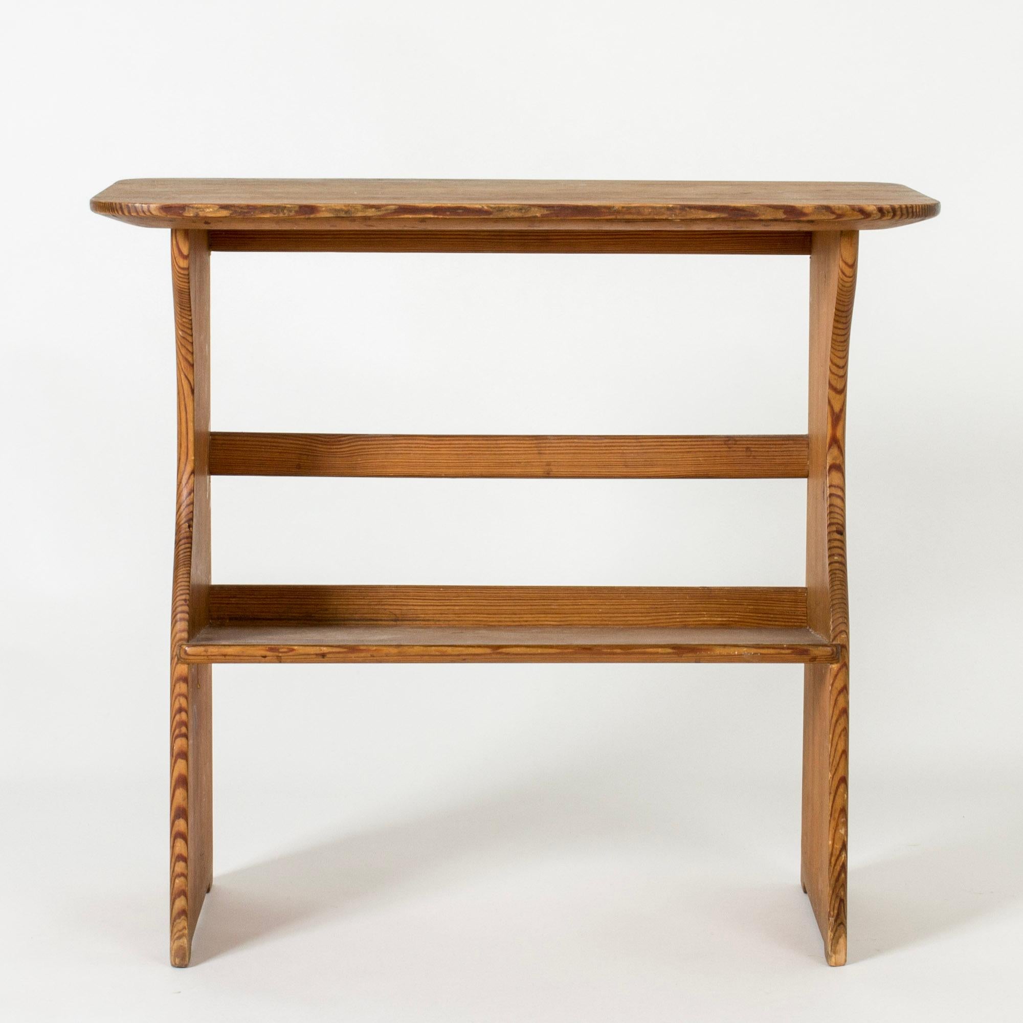 Neat Swedish Modern pine console or bedside table by Carl Malmsten, with a rustic touch. Very nice woodgrain.