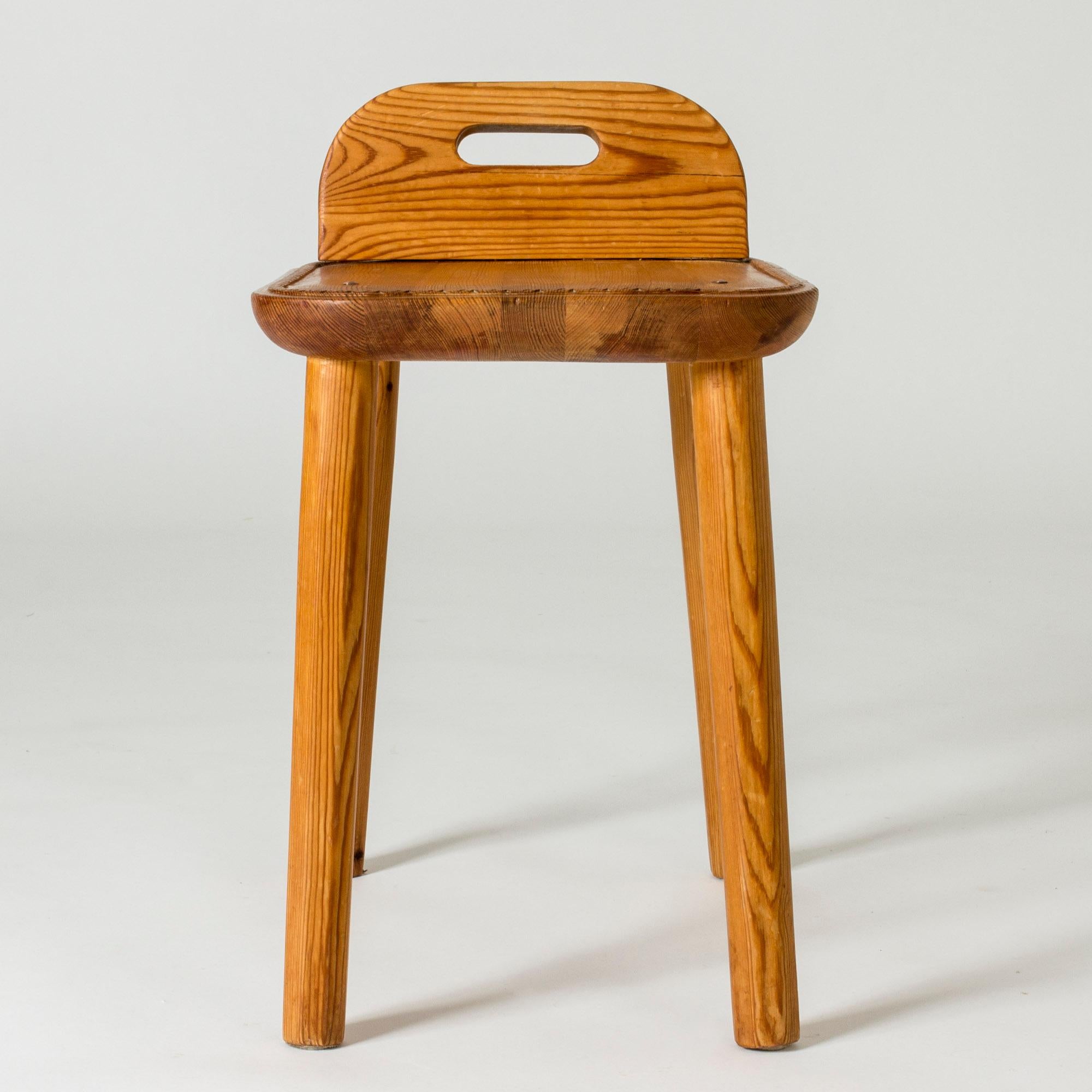 Cute Swedish midcentury pine stool, in a chunky design. Handle in the back and a decorative pattern around the edge of the seat.